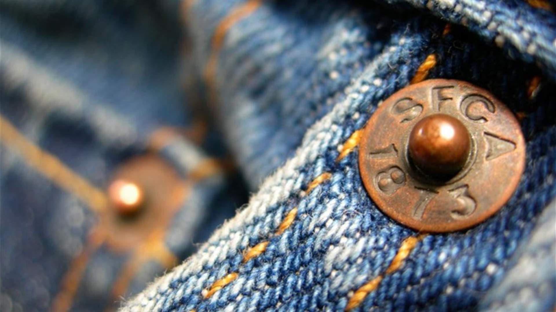 This Is the Reason Your Jean Pockets Have Tiny Buttons on Them