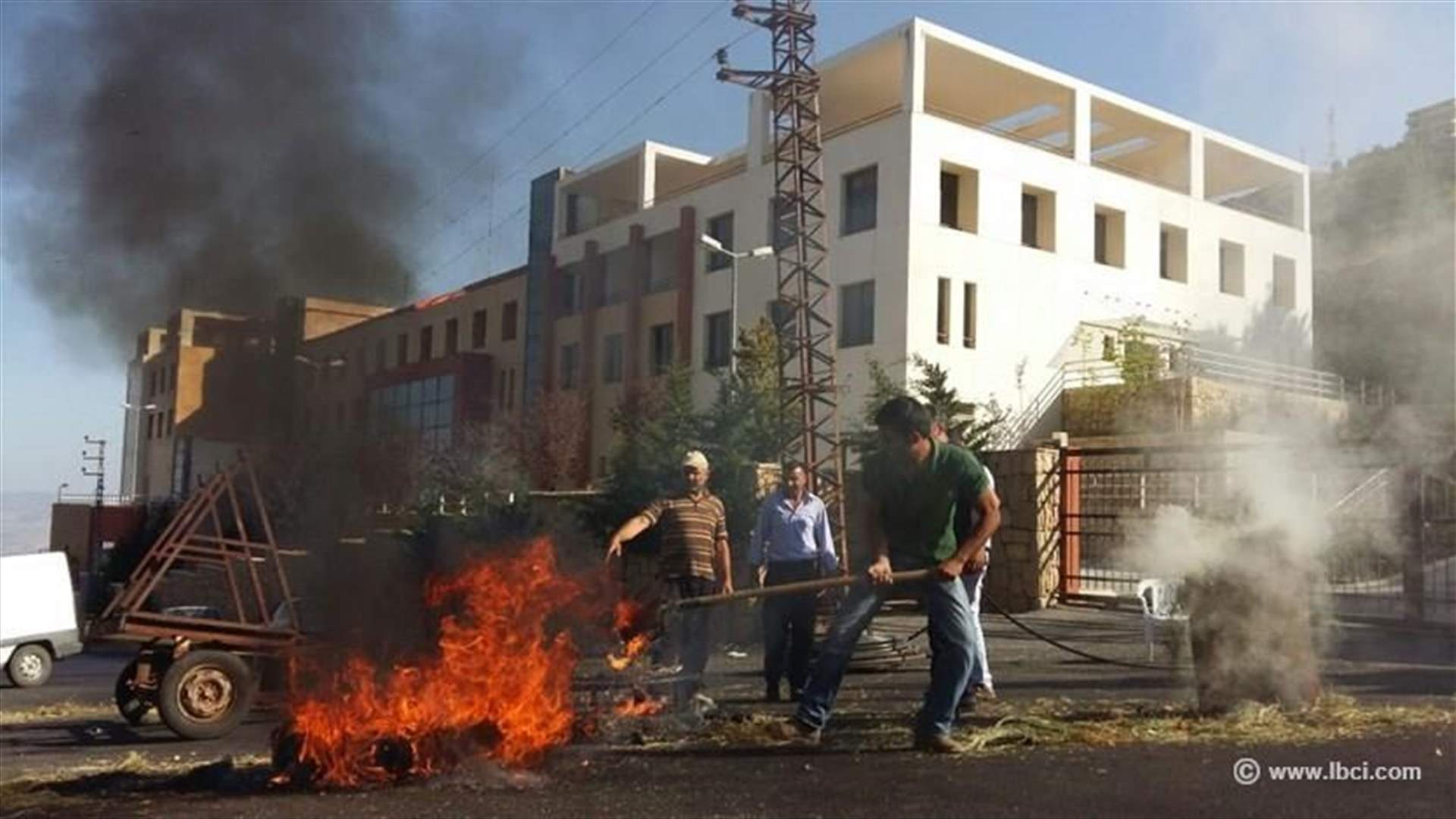 Employees of closed Shebaa hospital burn tires to protest their discharge