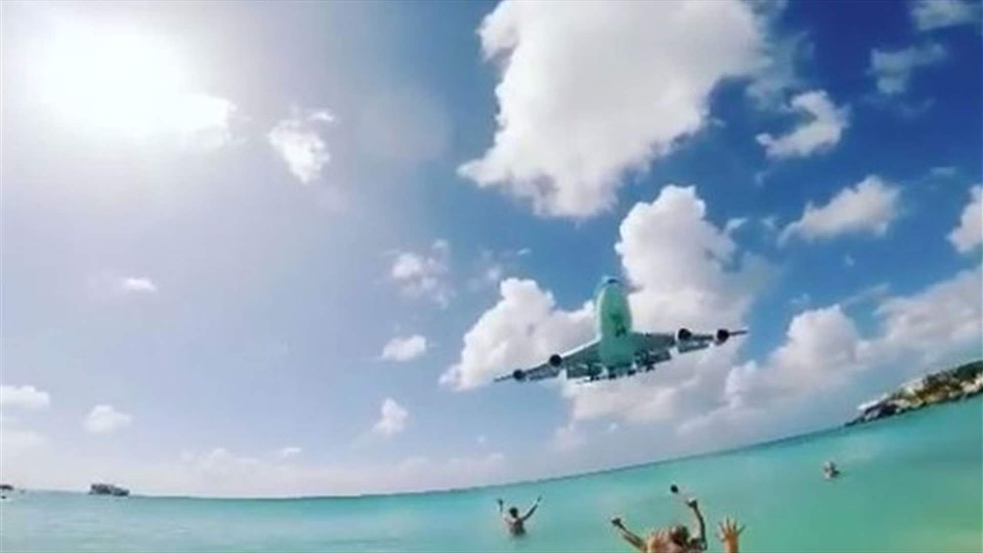 [VIDEO] Plane Comes Close To Tourists On Beach As It Prepares To Land 