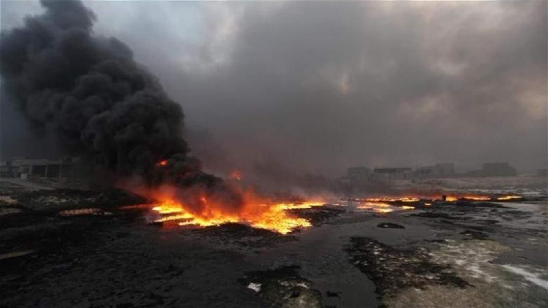 Iraq puts out more oil fires at northern field, some still burning