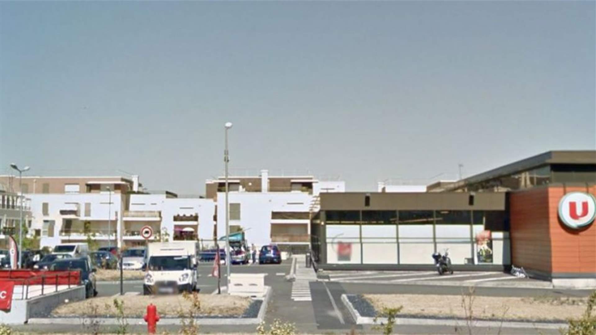 Police say man opens fire, injuring two, near supermarket west of Paris