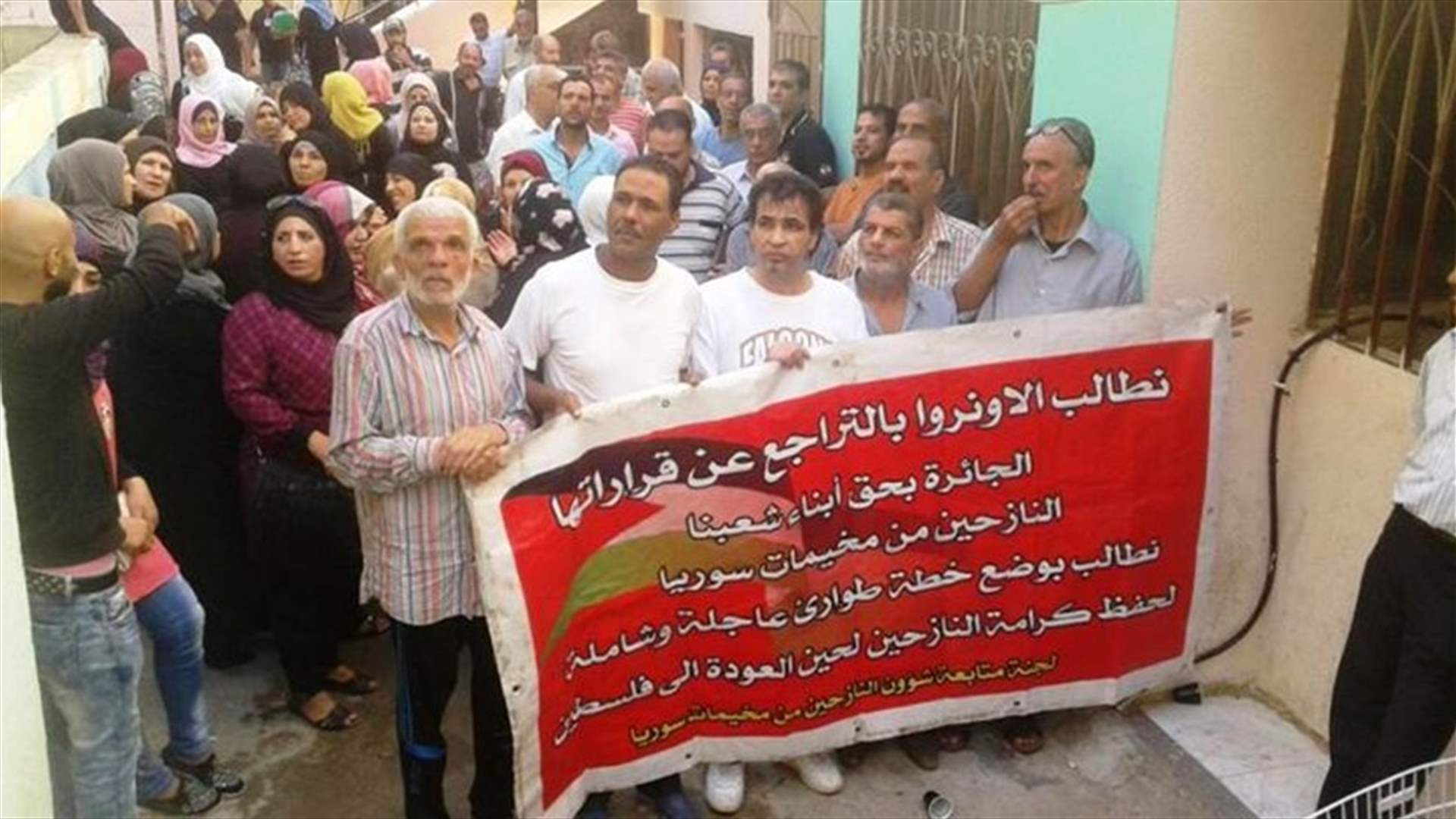 Palestinians from Syrian refugee camps protest outside Beddawi Camp