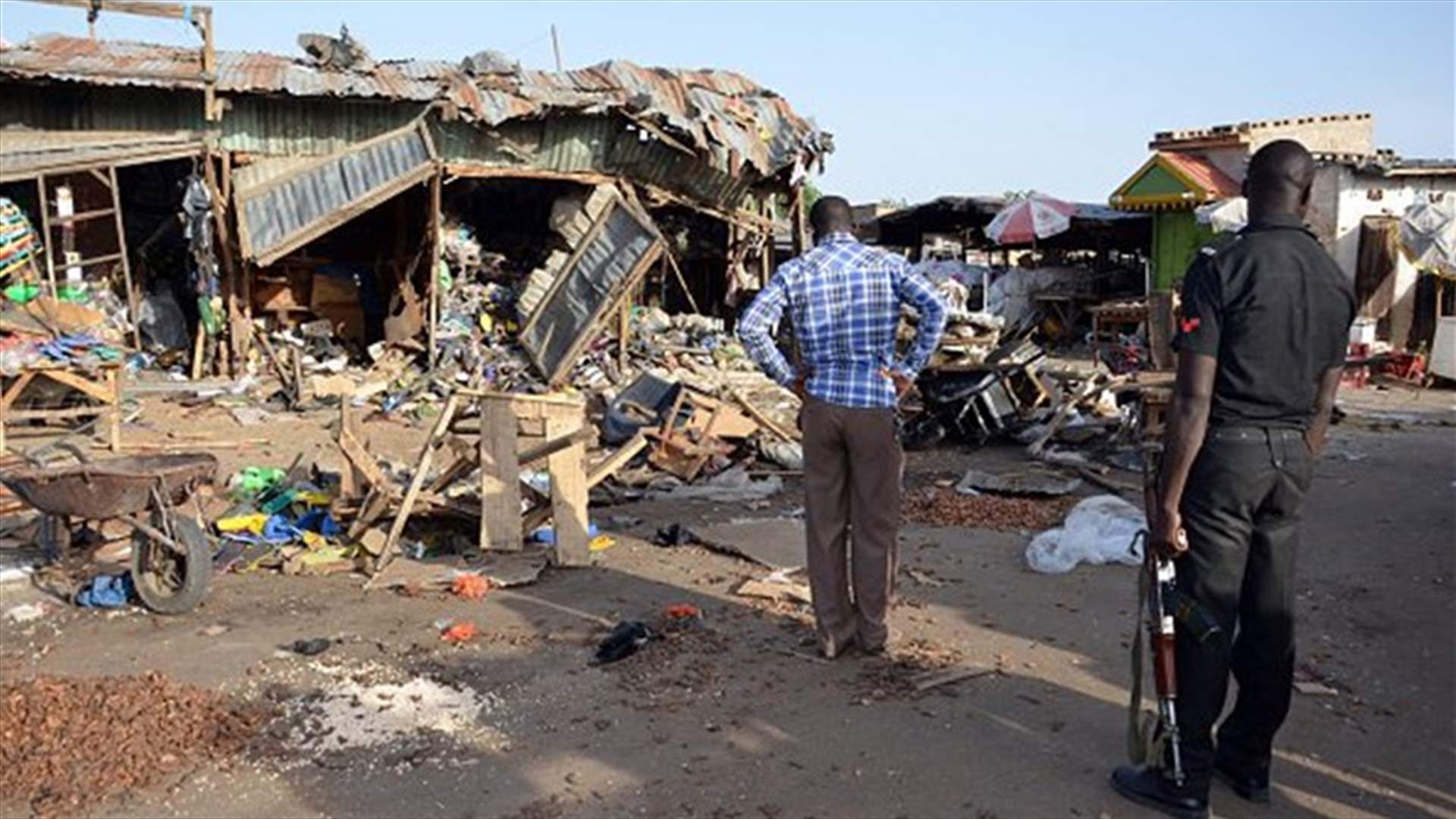 Schoolgirl suicide bombers kill 30 in Nigerian market -army