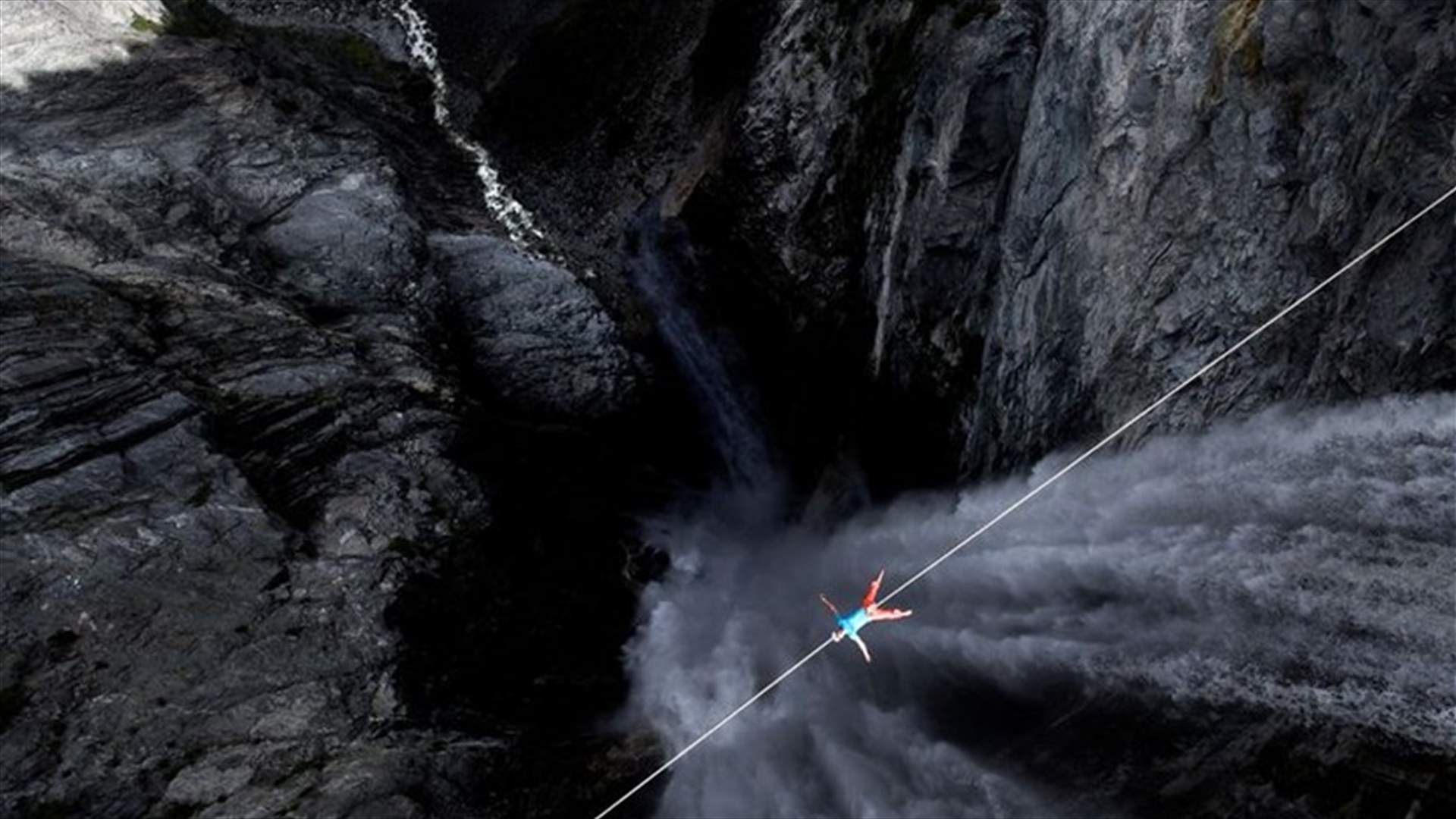 Terrifying Moment Slackliner Lies Down On Rope 400 Meters Above World's Highest Waterfall