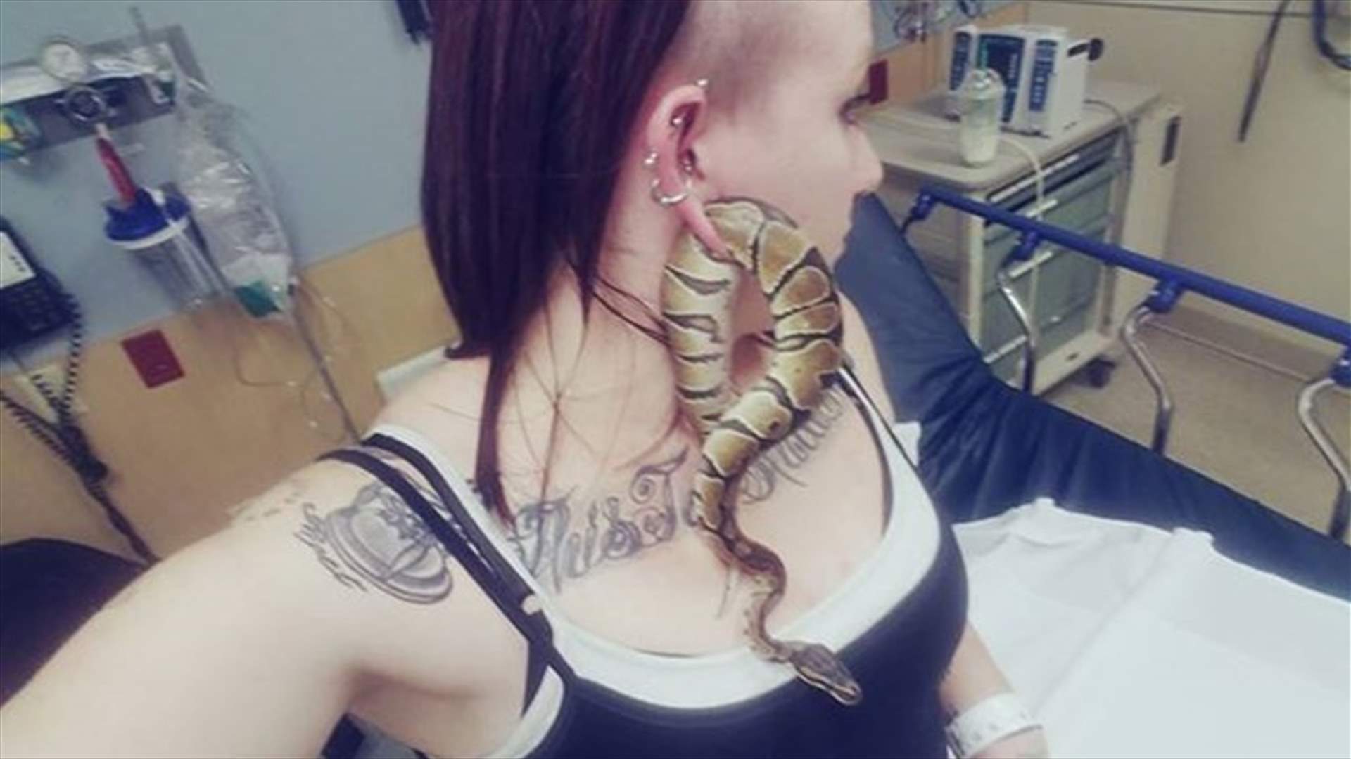 [PHOTOS] Woman Gets Pet Snake Stuck Inside Earlobe