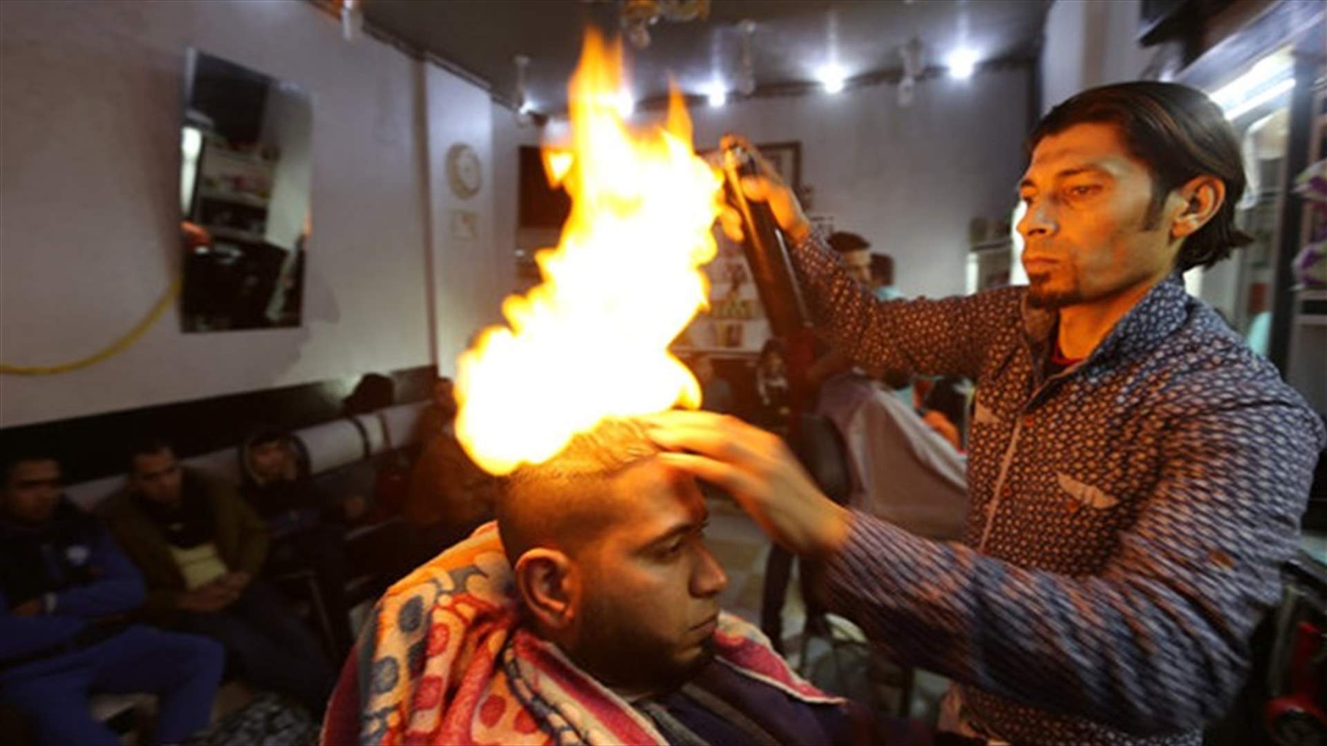 [VIDEO] Gazan Barber Offers Flaming Hot Hair Straightening