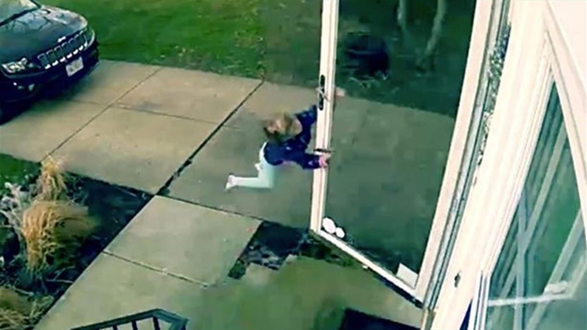 [VIDEO] Hilarious Moment Little Girl Opens Front Door To Be Literally Blown Away By High Winds