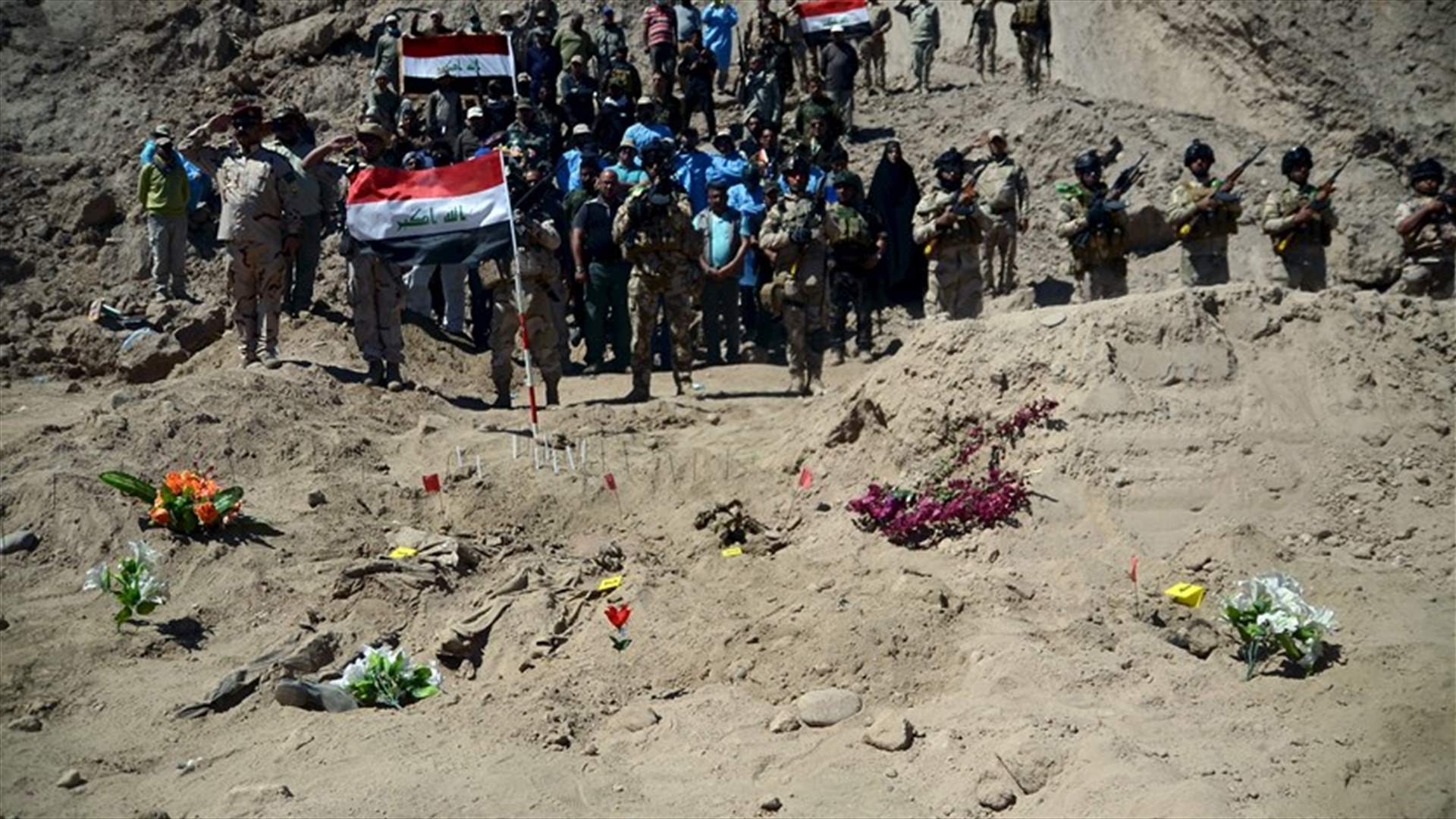 Iraqi forces unearth mass grave of Shi&#39;ite inmates killed by IS