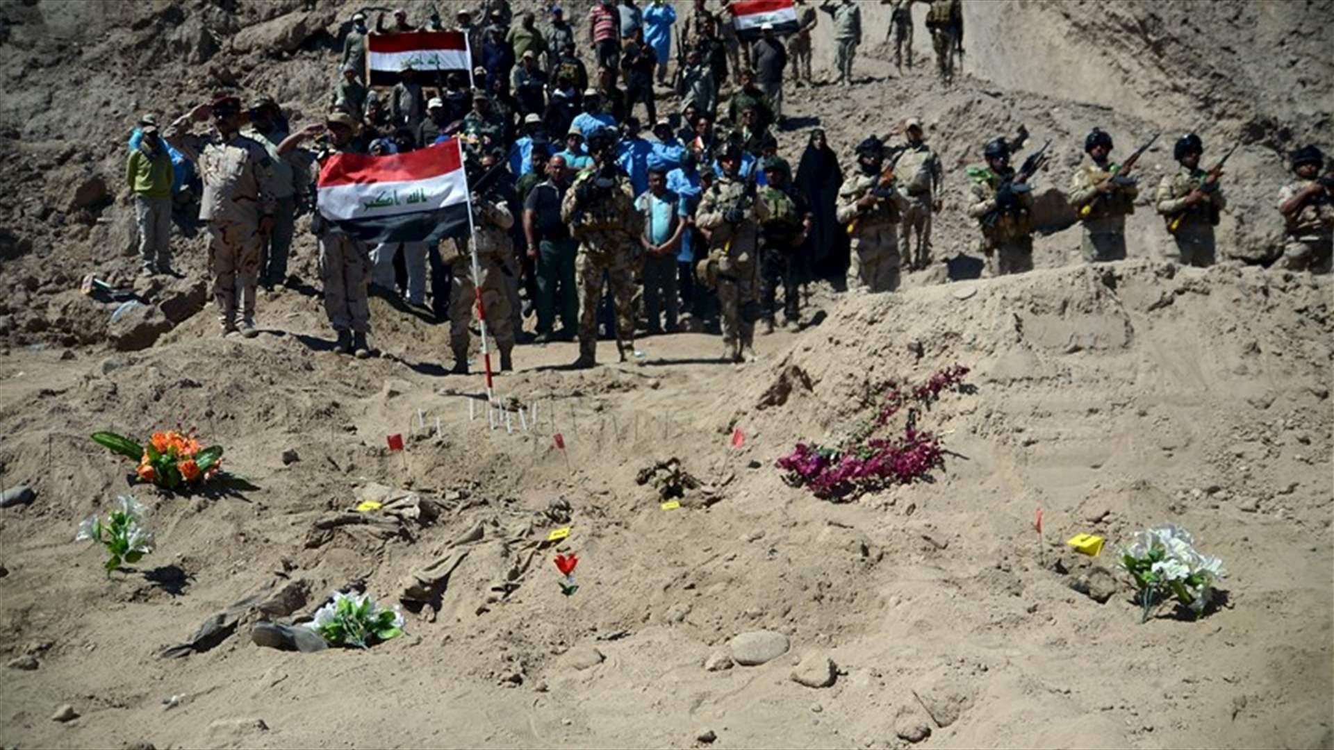 Iraqi forces unearth mass grave of Shi'ite inmates killed by IS