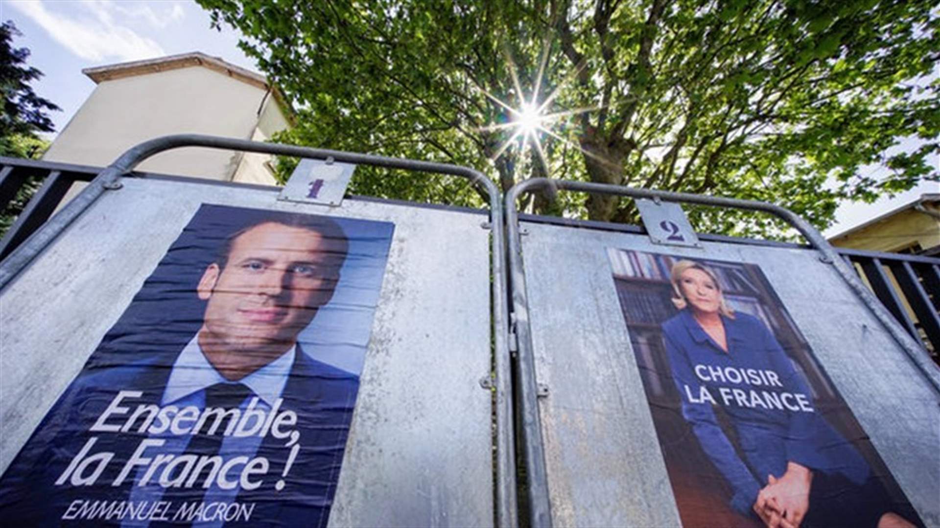 Macron, Le Pen exchange May Day blows on day of rallies and protests