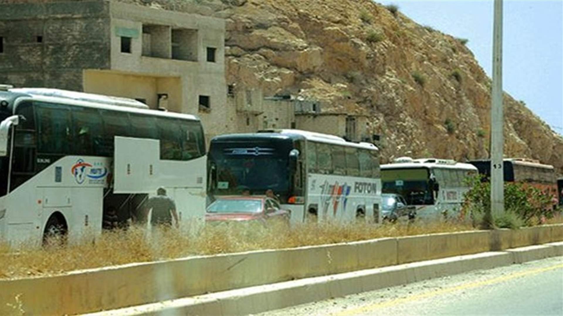 Syrian rebels begin to leave last opposition-held Homs district