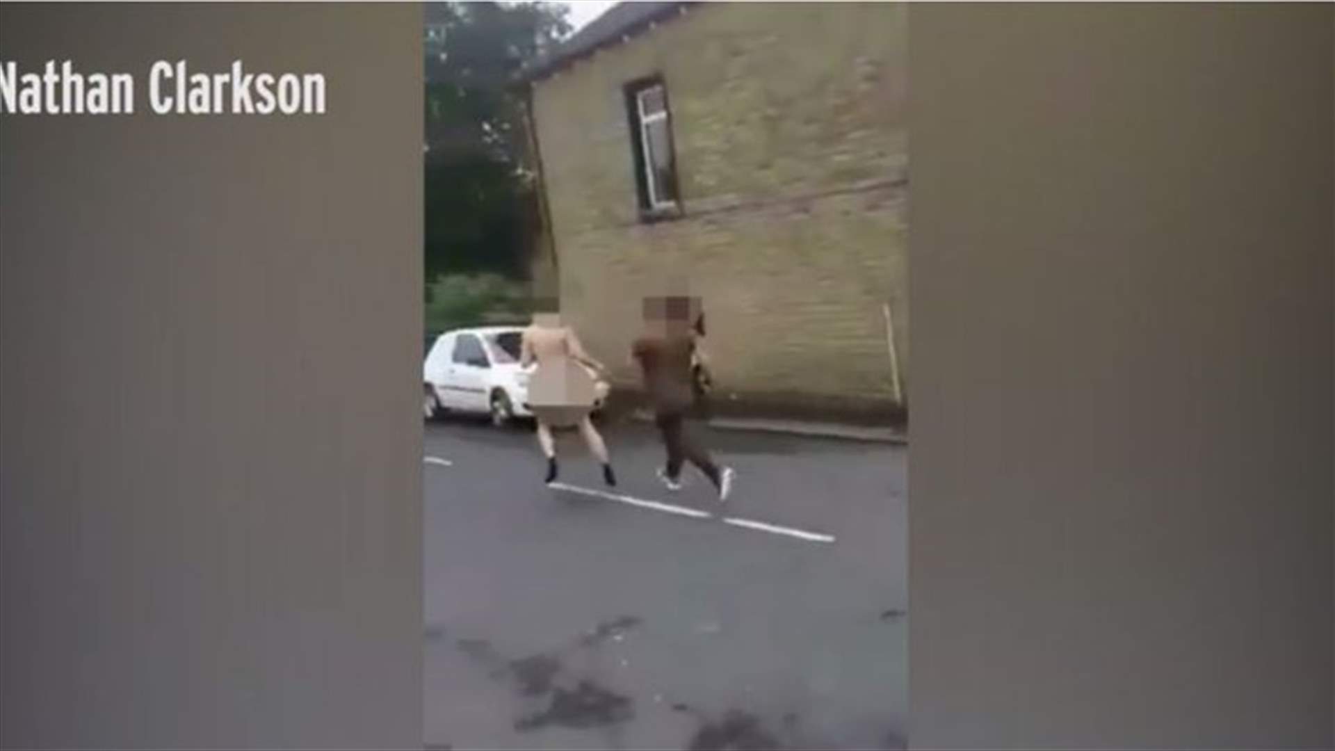 VIDEO – Bizarre Moment Naked Man Fights Fully-Clothed Foe In Street