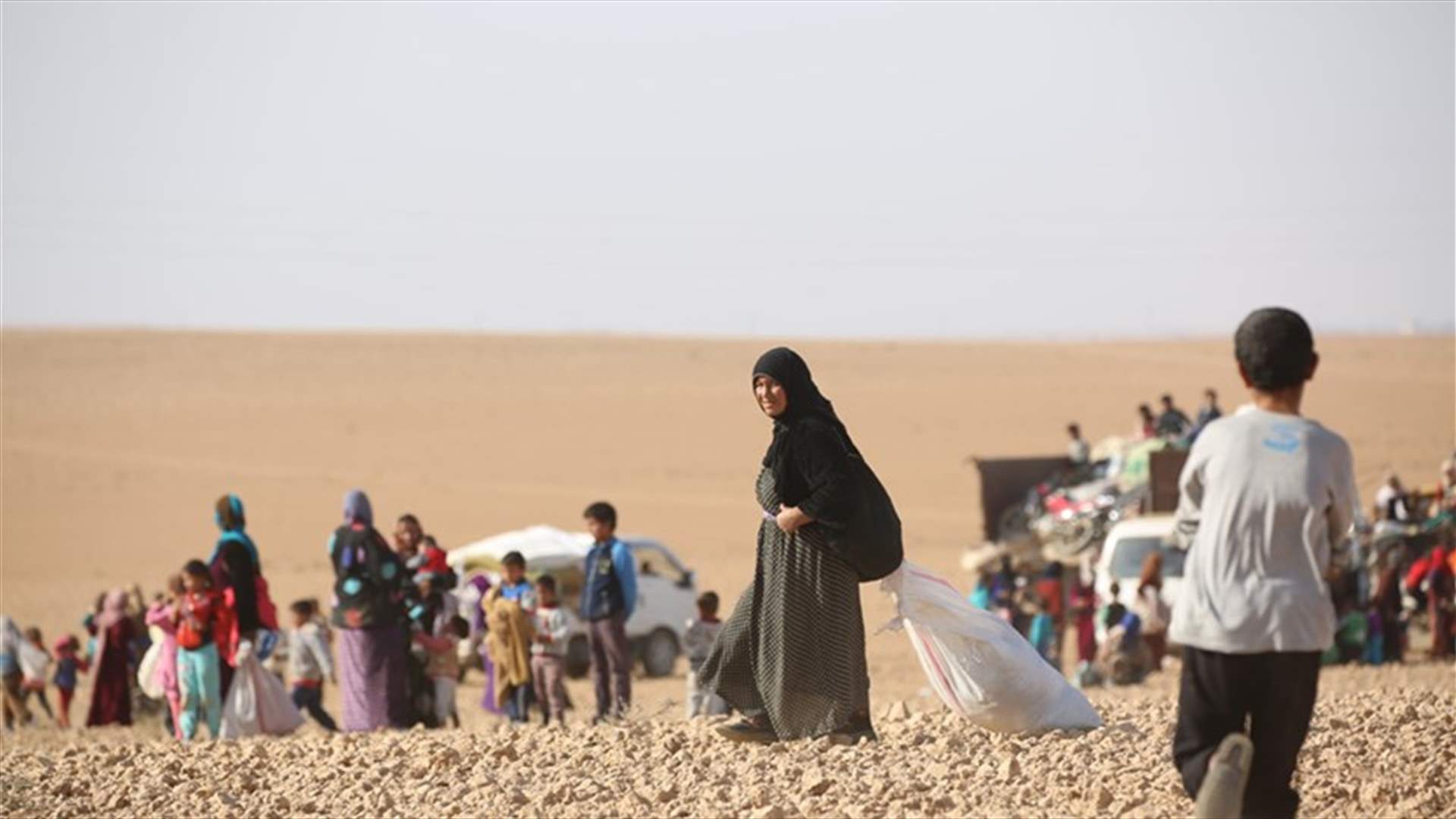 Families fleeing Syria's Raqqa say air strikes bring heavy toll
