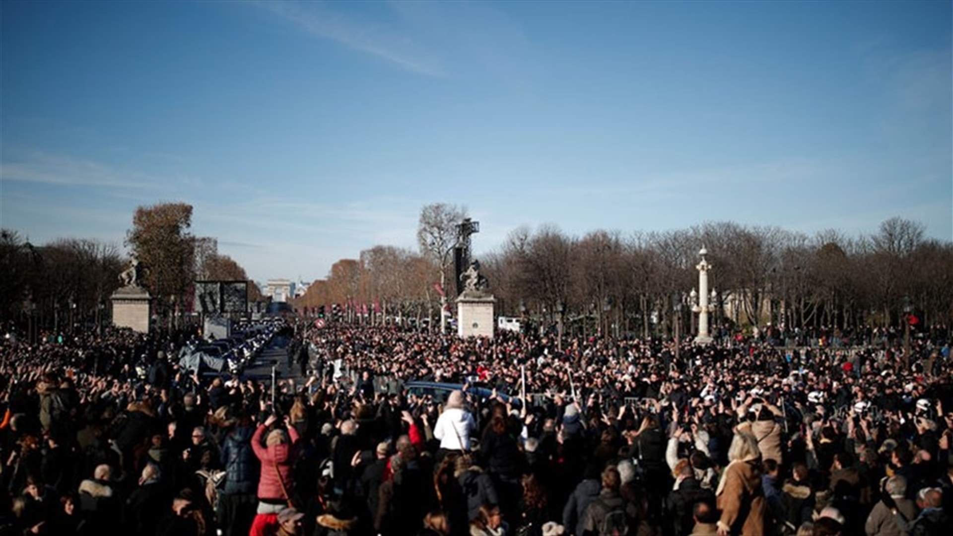 Thousands mourn rock idol Hallyday at Paris memorial