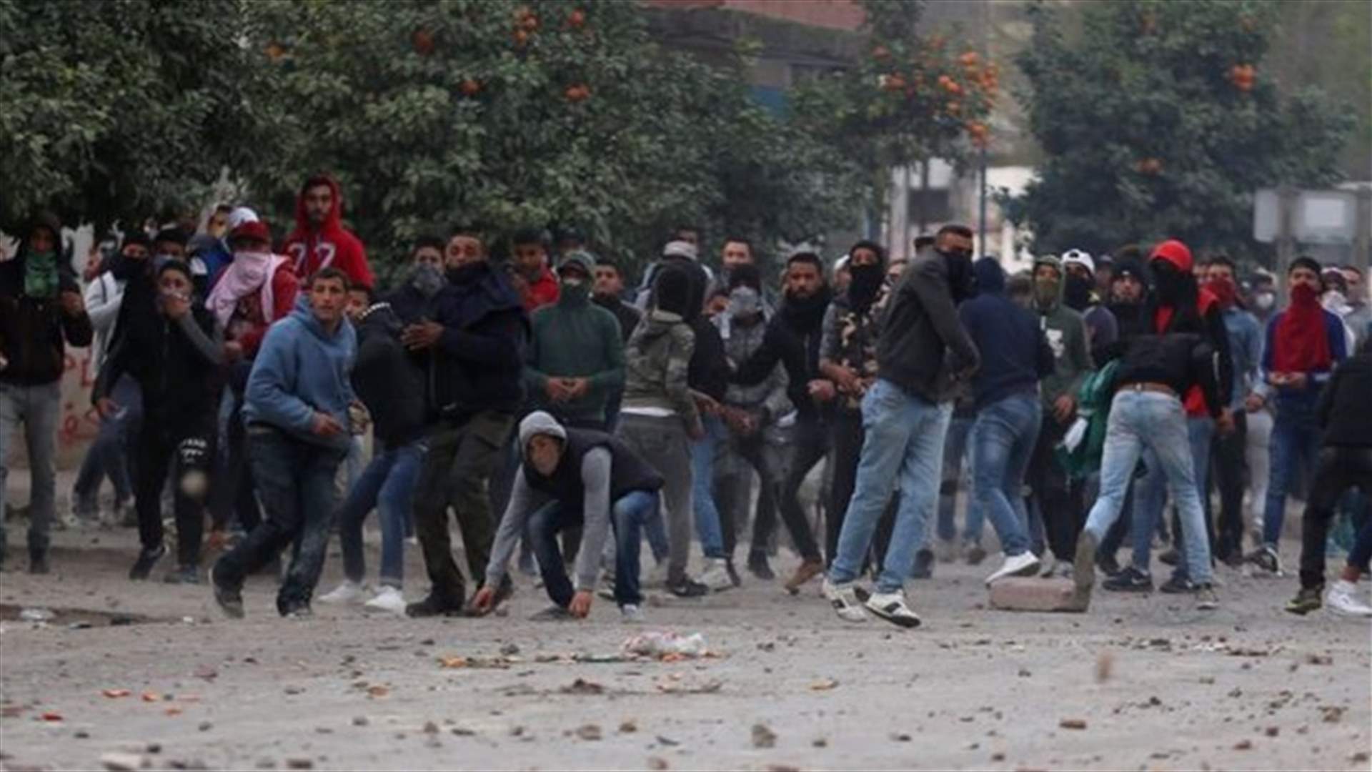 Tunisia arrests another 150 including opposition leaders over unrest