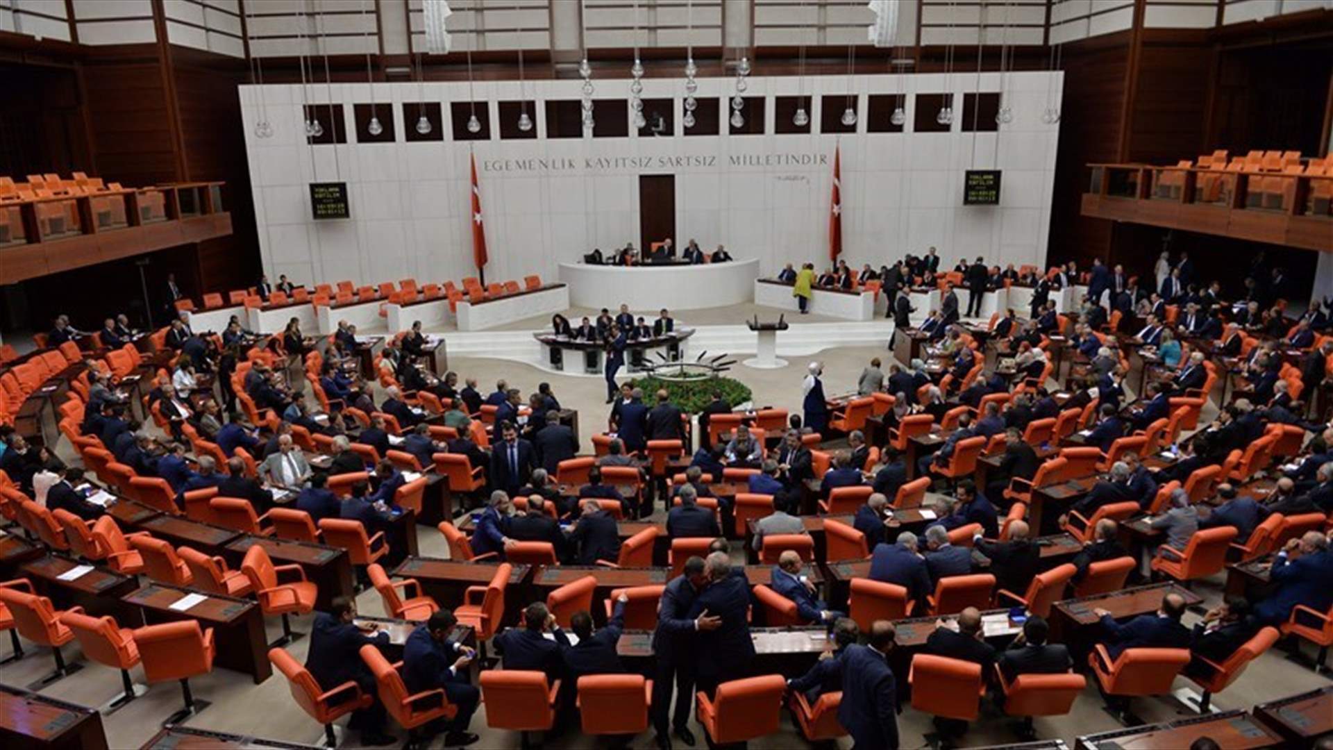 Turkish parliament passes controversial voting law, as brawl ensues