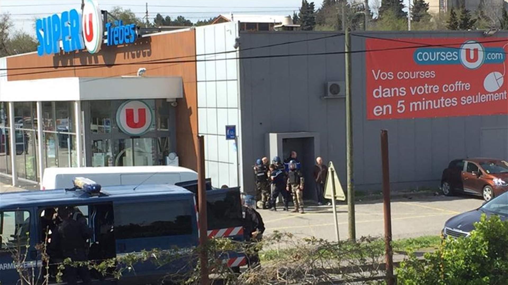 Three killed in France in shooting, supermarket hostage-taking