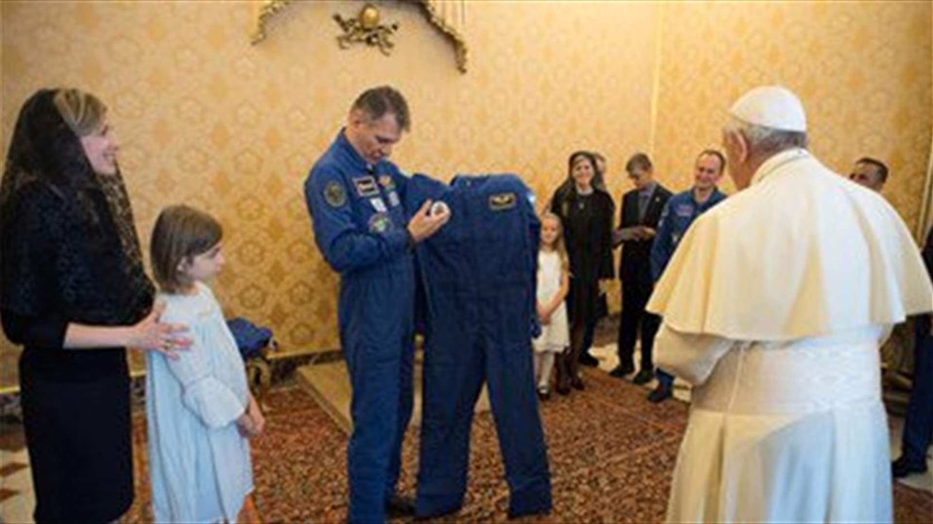 Astronauts give pope personalized space suit, add white cape