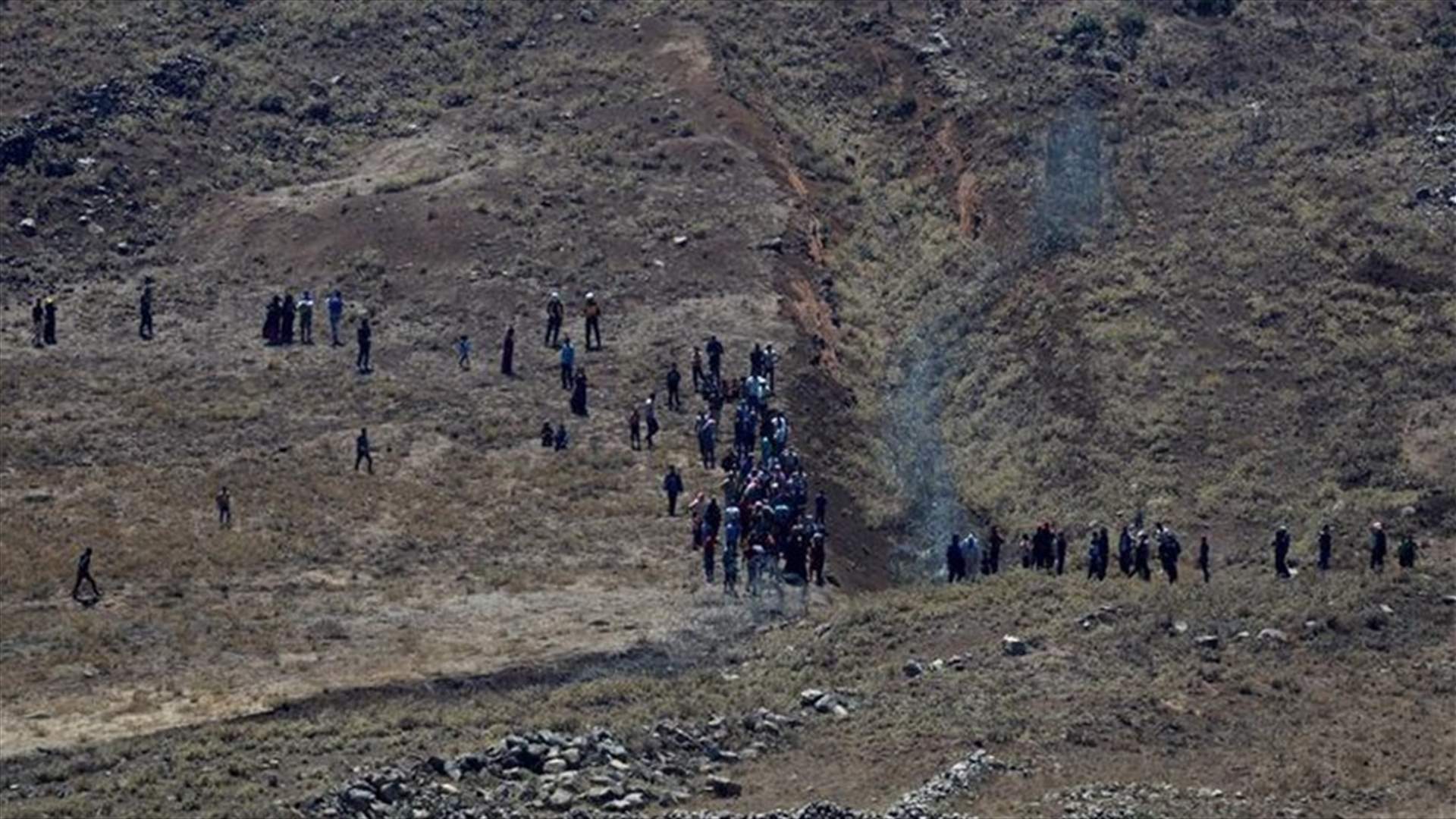 Israel warns Syrians away from frontier as Assad closes in