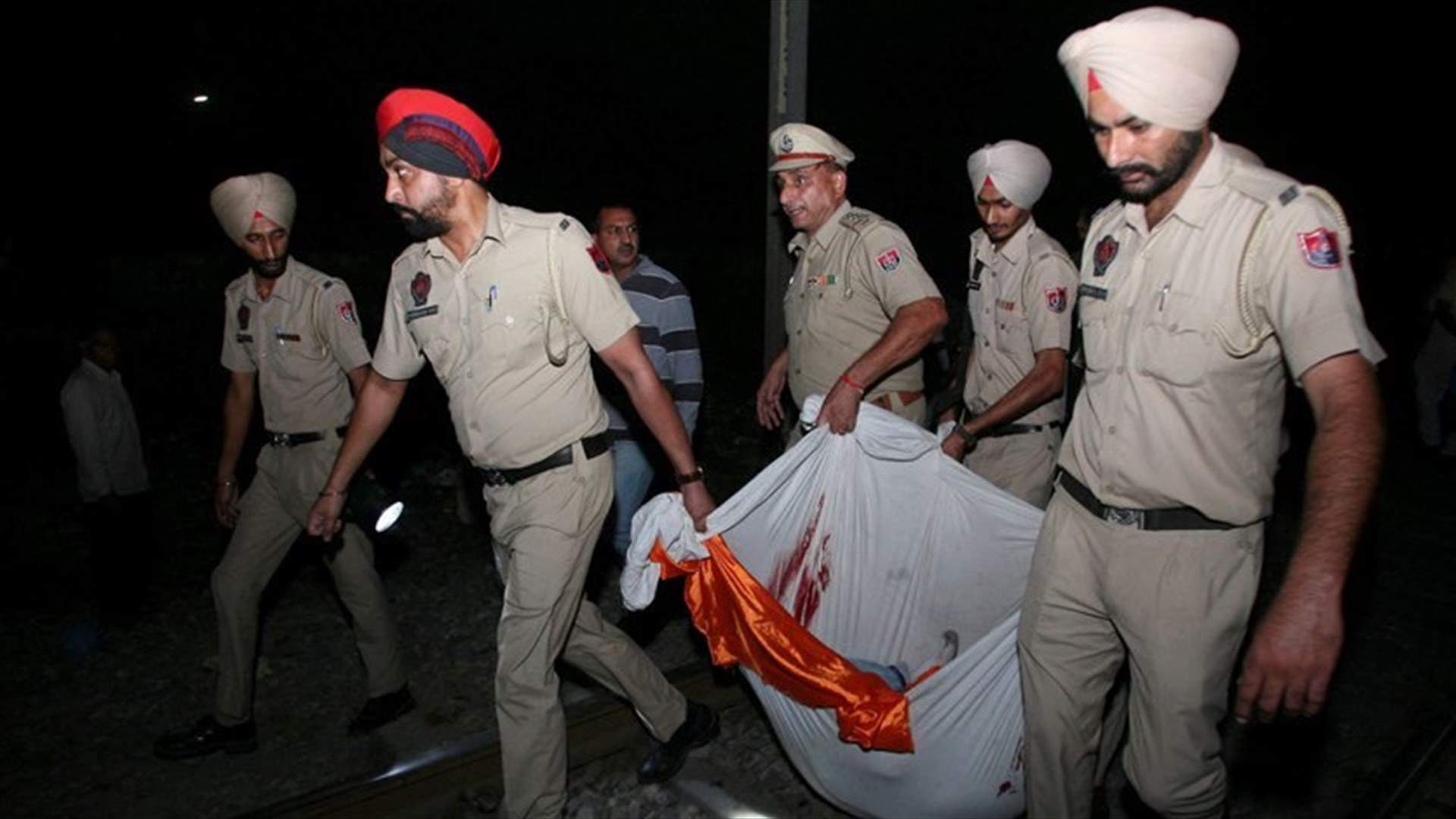 Commuter train runs over crowd on tracks in northern India, 50 feared dead