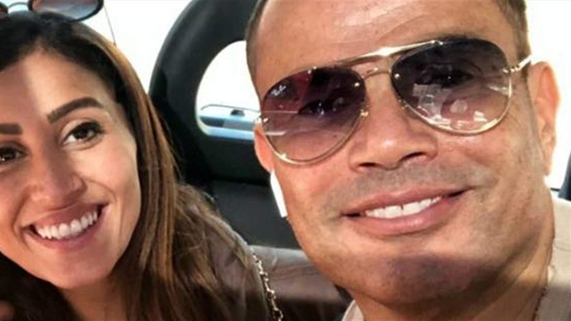 شجار بين عمرو دياب ورجل أمن انكليزي بسبب دينا الشربيني (فيديو)