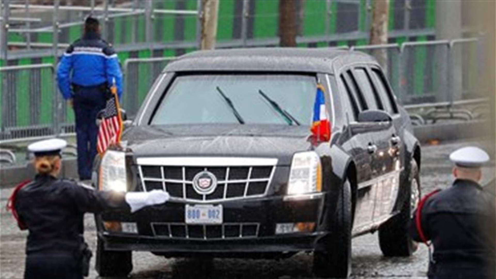 Topless female protester runs at Trump's motorcade in Paris - [PHOTOS]