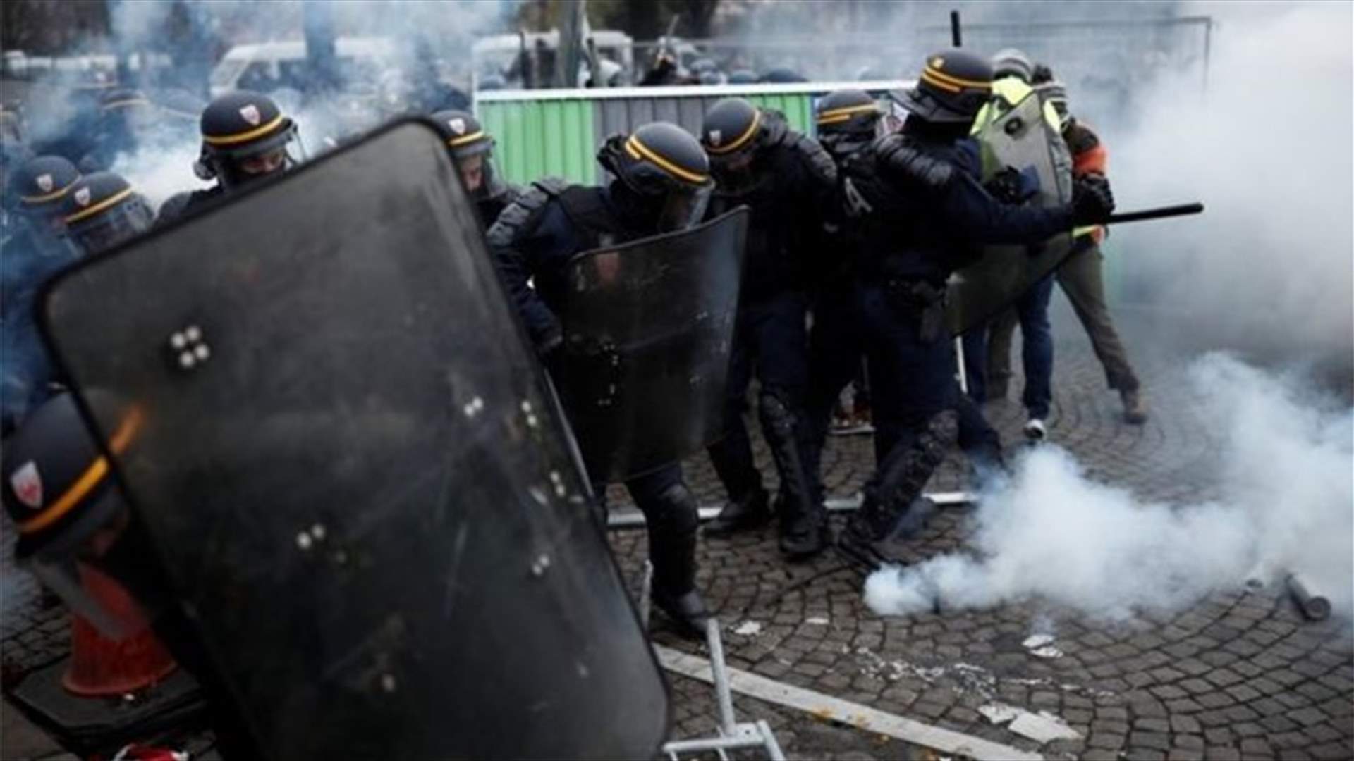 French police fire tear gas at fuel price protesters