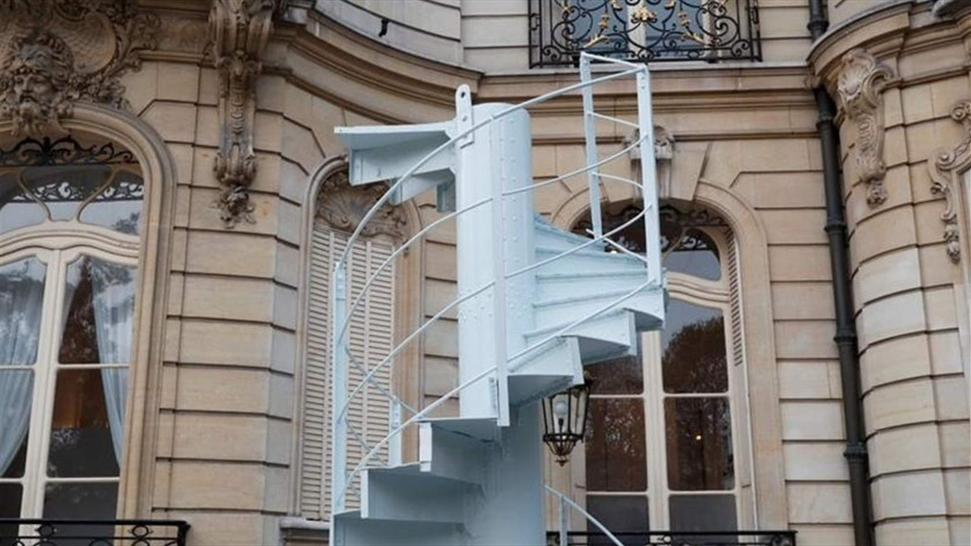 Piece of Eiffel Tower staircase sells for 169,000 euros in Paris auction