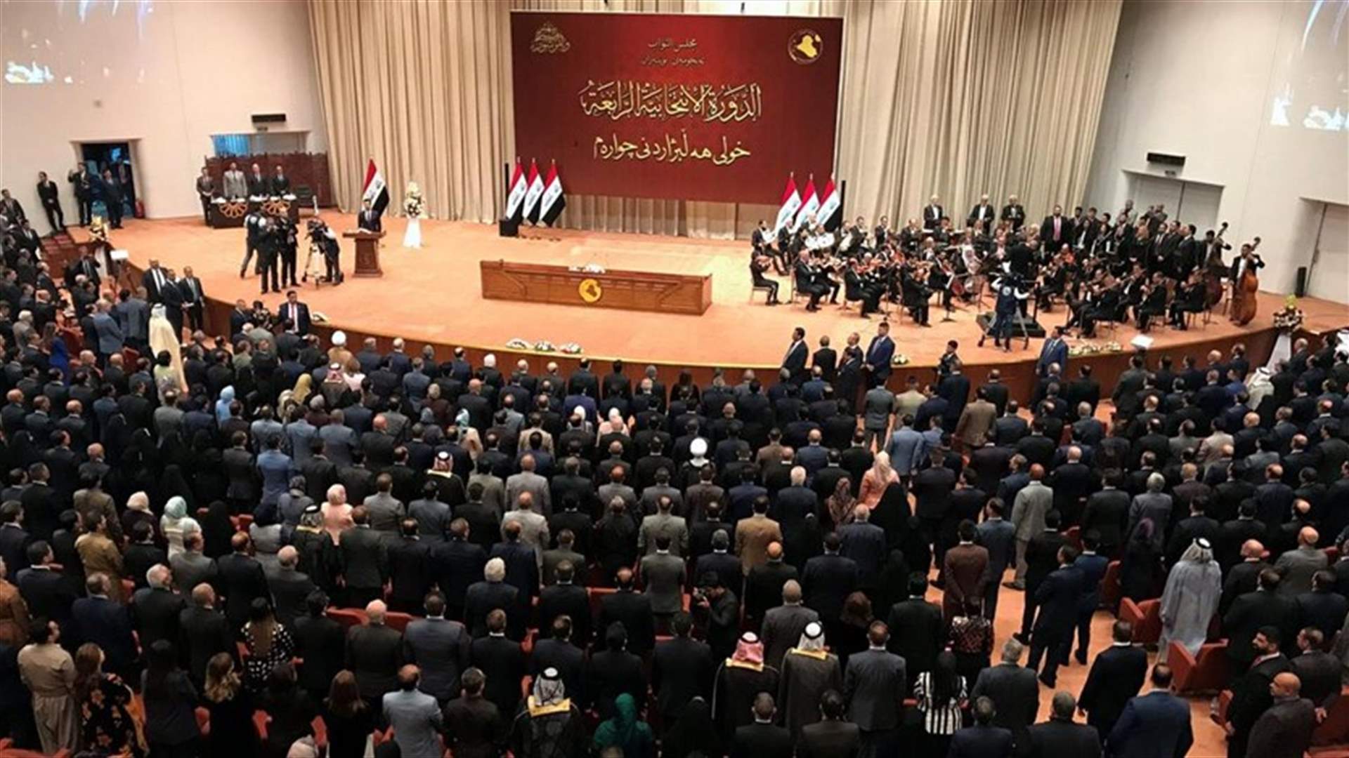 Raucous Iraqi MPs halt session to vote on government