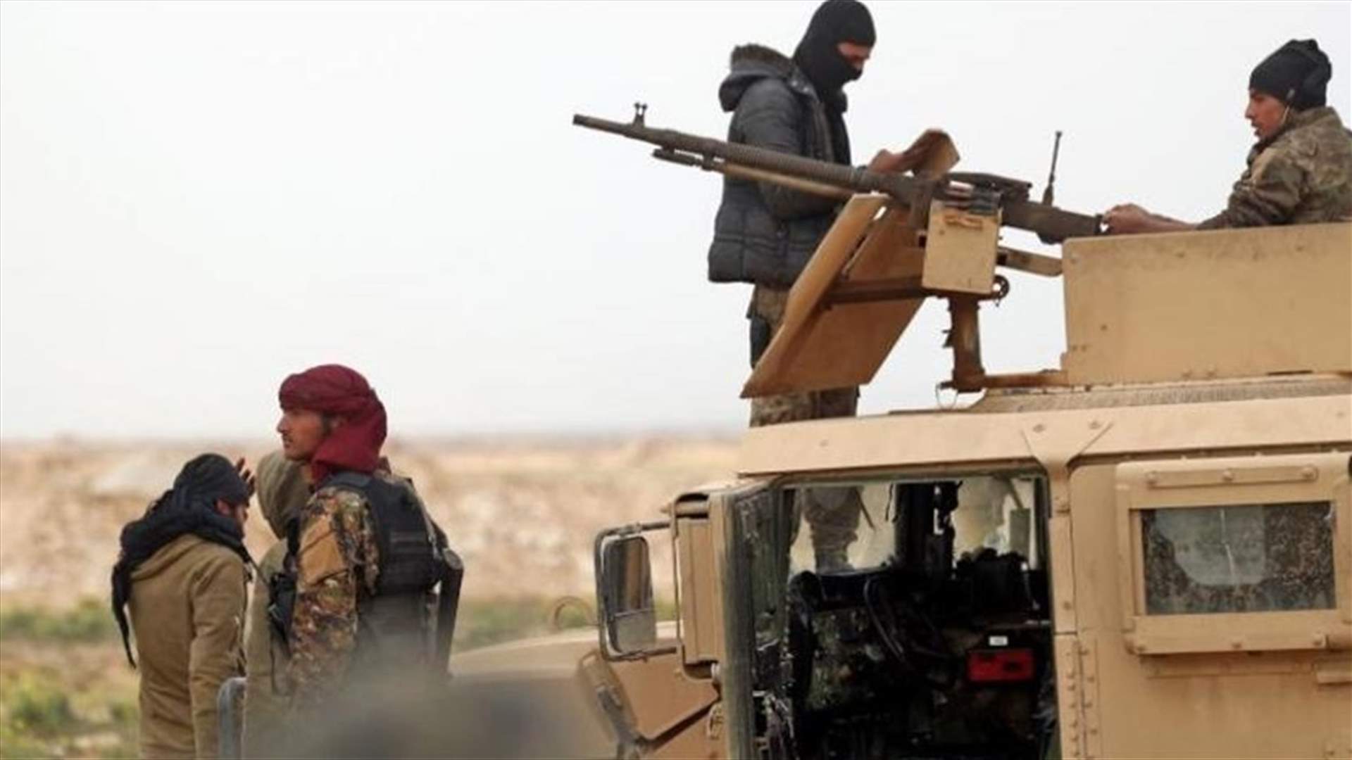 Islamic State fighters pinned on Syrian riverbank, warplanes fly above