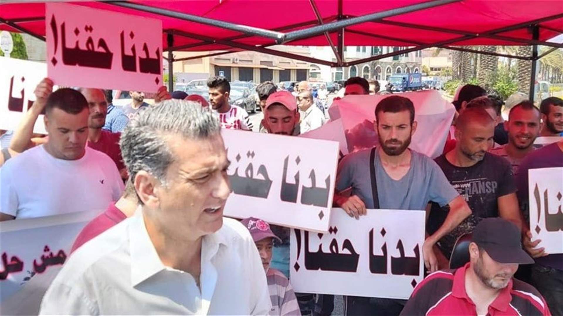 People with special needs block Mina road to protest against removal of their kiosks