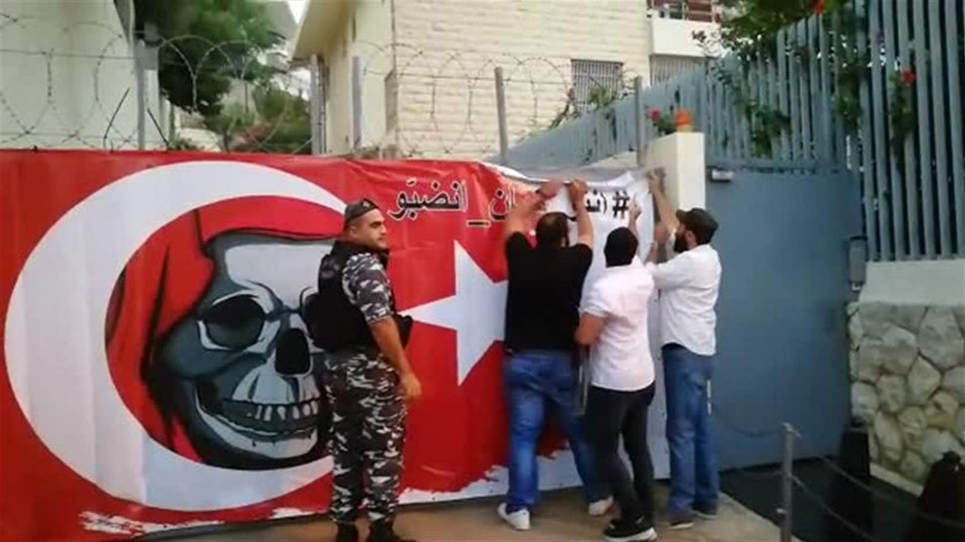 Sign at Turkish embassy entrance in response to Turkish FM statement-[VIDEOS]