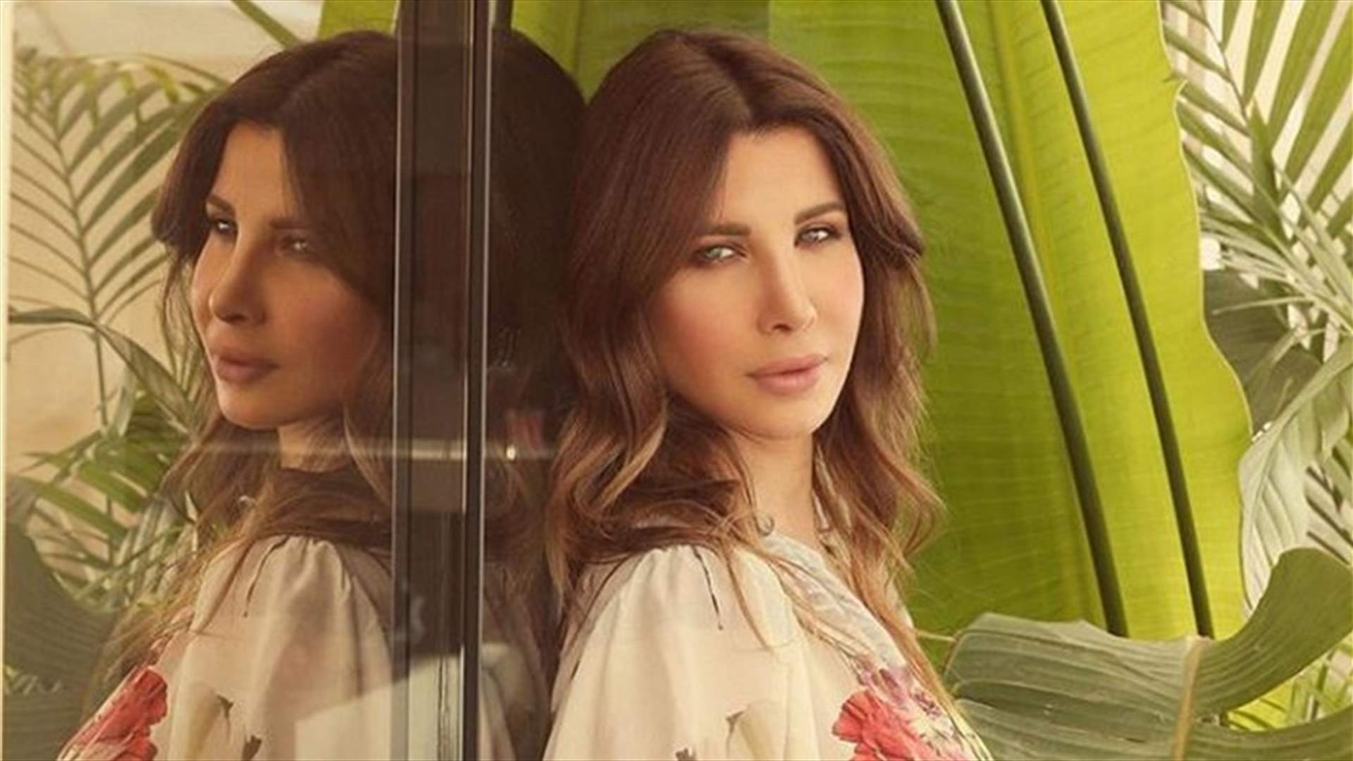 نانسي عجرم تتحايل للظهور بطول زوجها.. وتتساءل بطرافة &quot;مين أطول؟&quot;