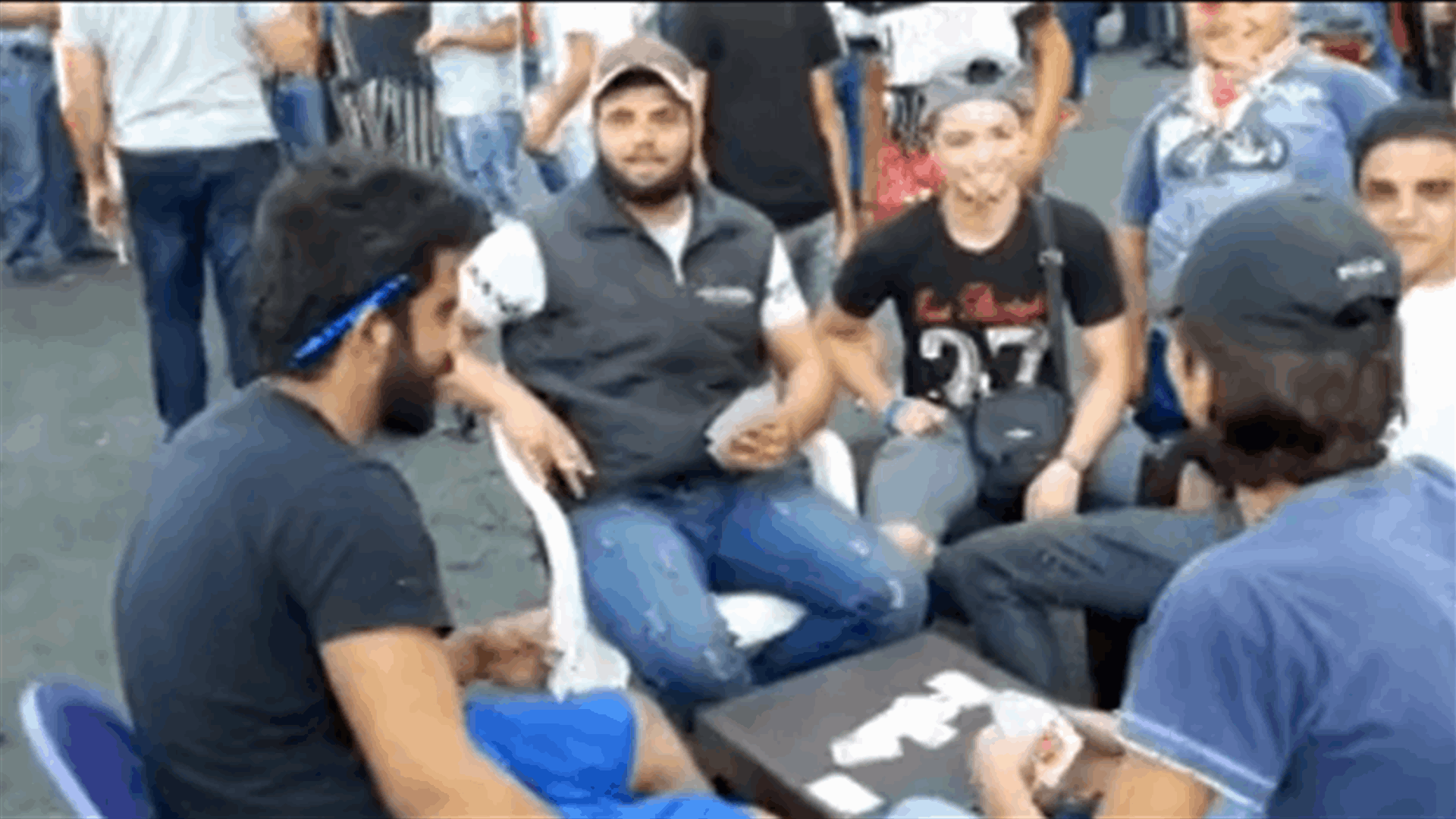 Protesters play cards in al-Nour Square in Tripoli (Video)