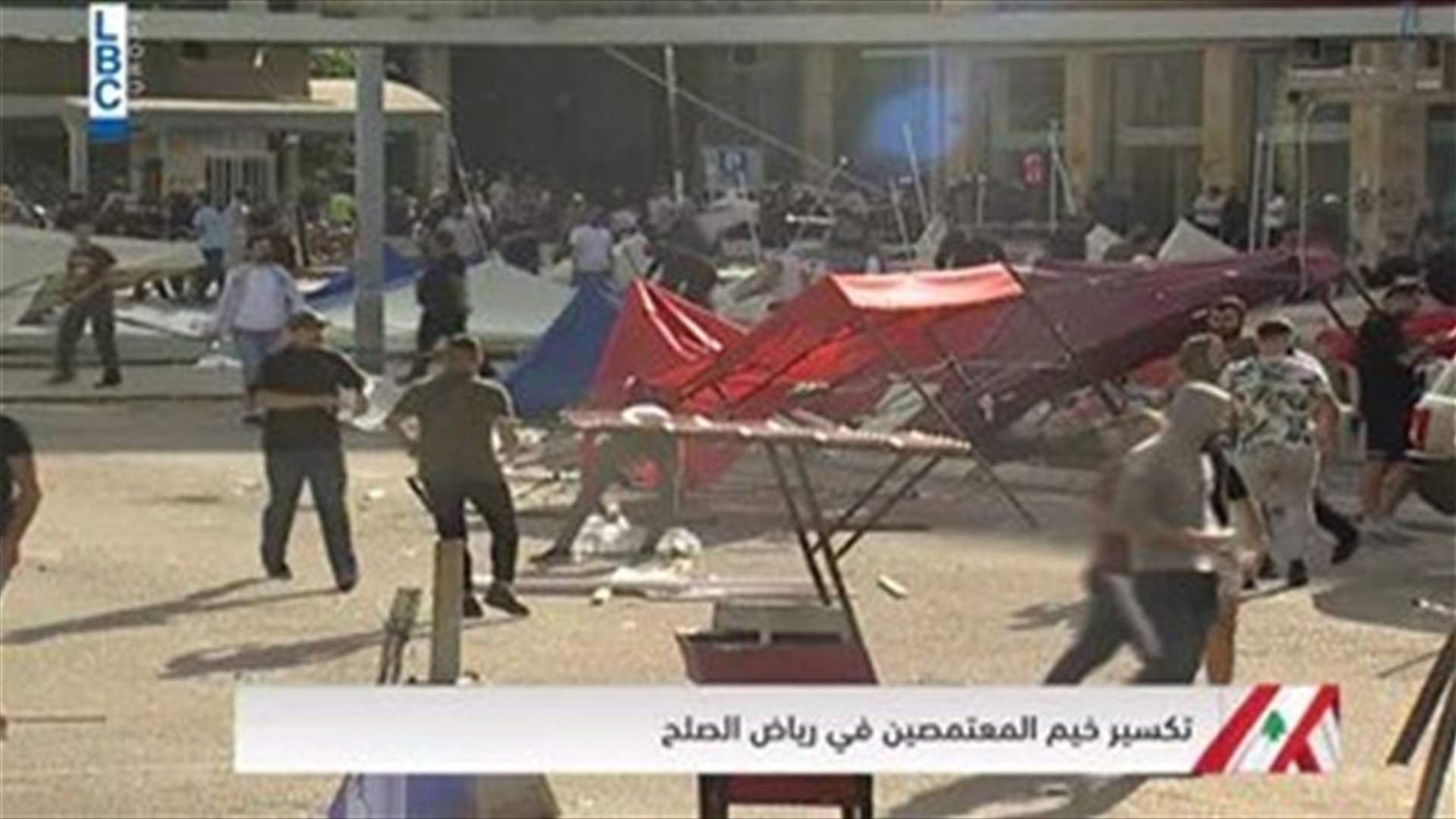 Men tear down tents in Riyad al-Soleh Square-[VIDEO]
