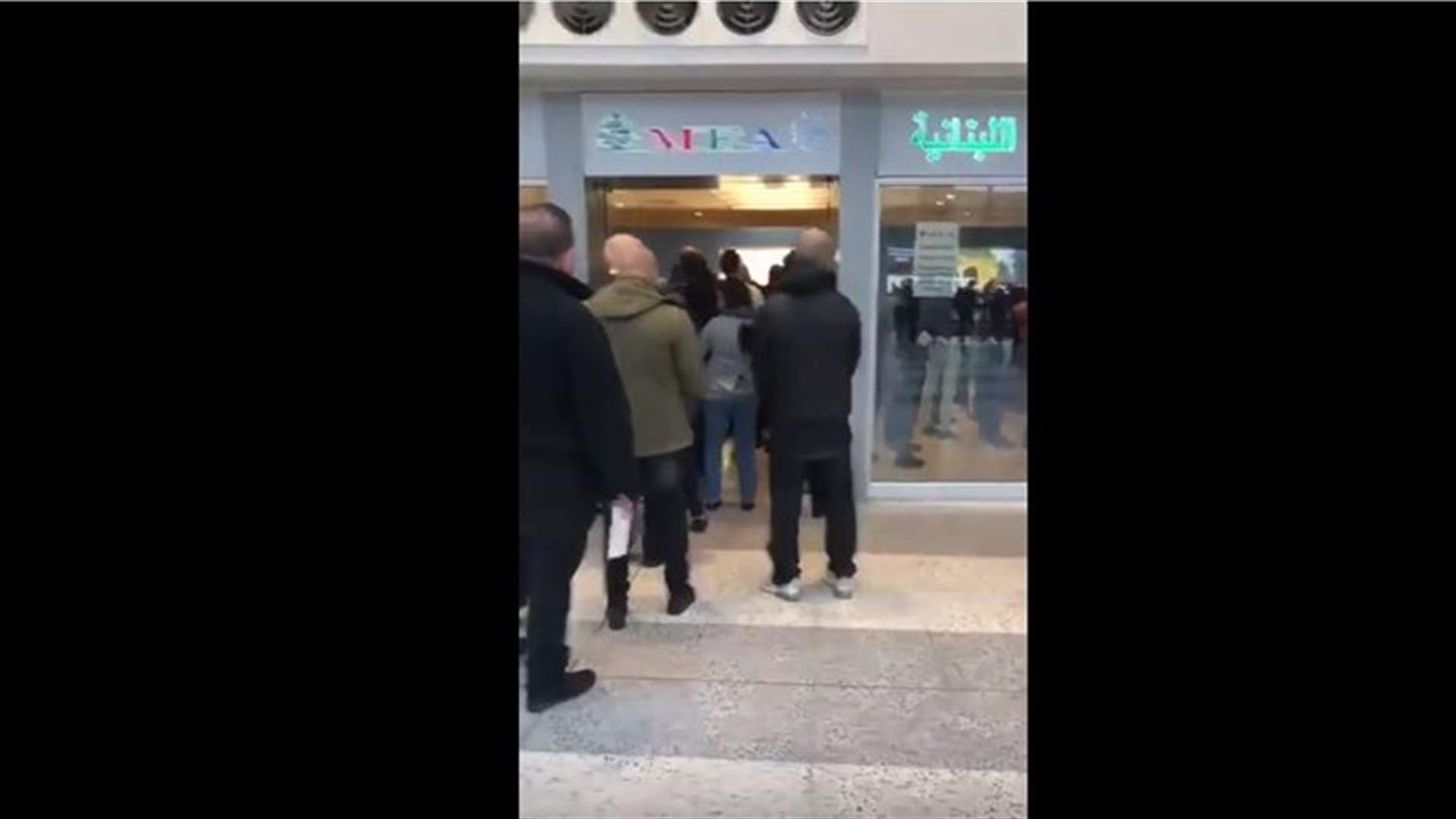 People crowd outside MEA office after decision to only accept Dollars (Video)