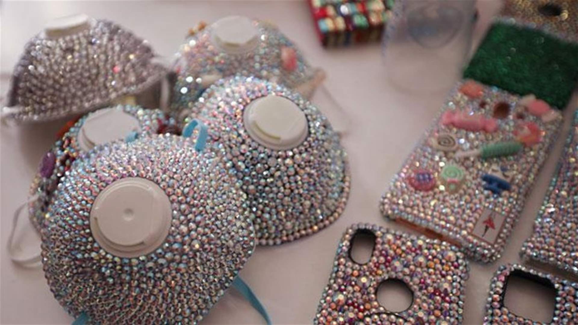 A Jordanian designer bedazzles masks to encourage corona safety