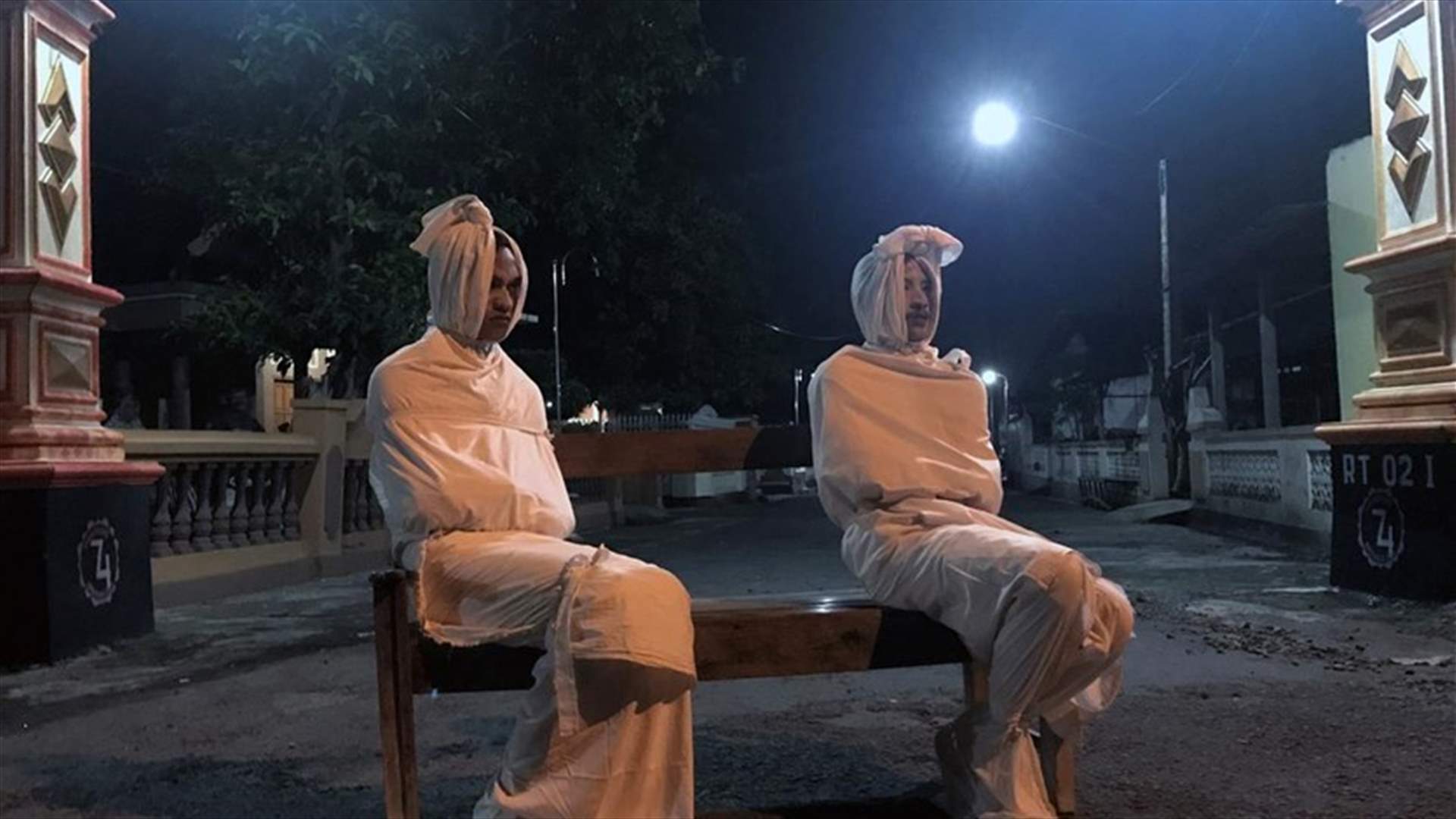 'Ghosts' scare Indonesians indoors and away from coronavirus