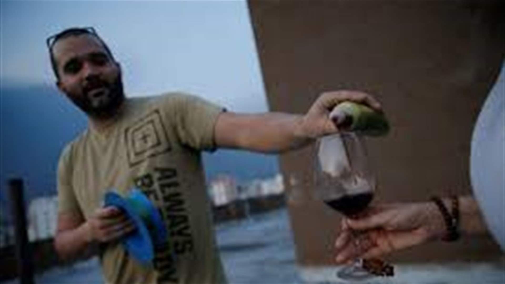 Venezuelans pass wine across rooftops to celebrate happy hour in quarantine