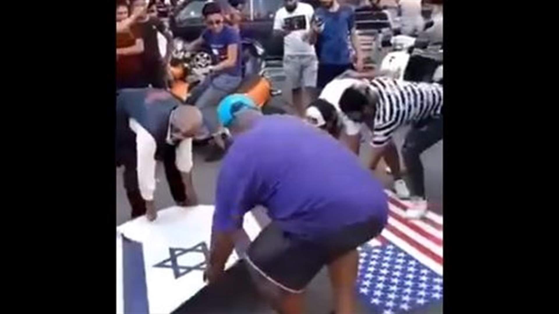 تحرك في حي السلم.. واحراق العلمين الأميركي والاسرائيلي (فيديو)