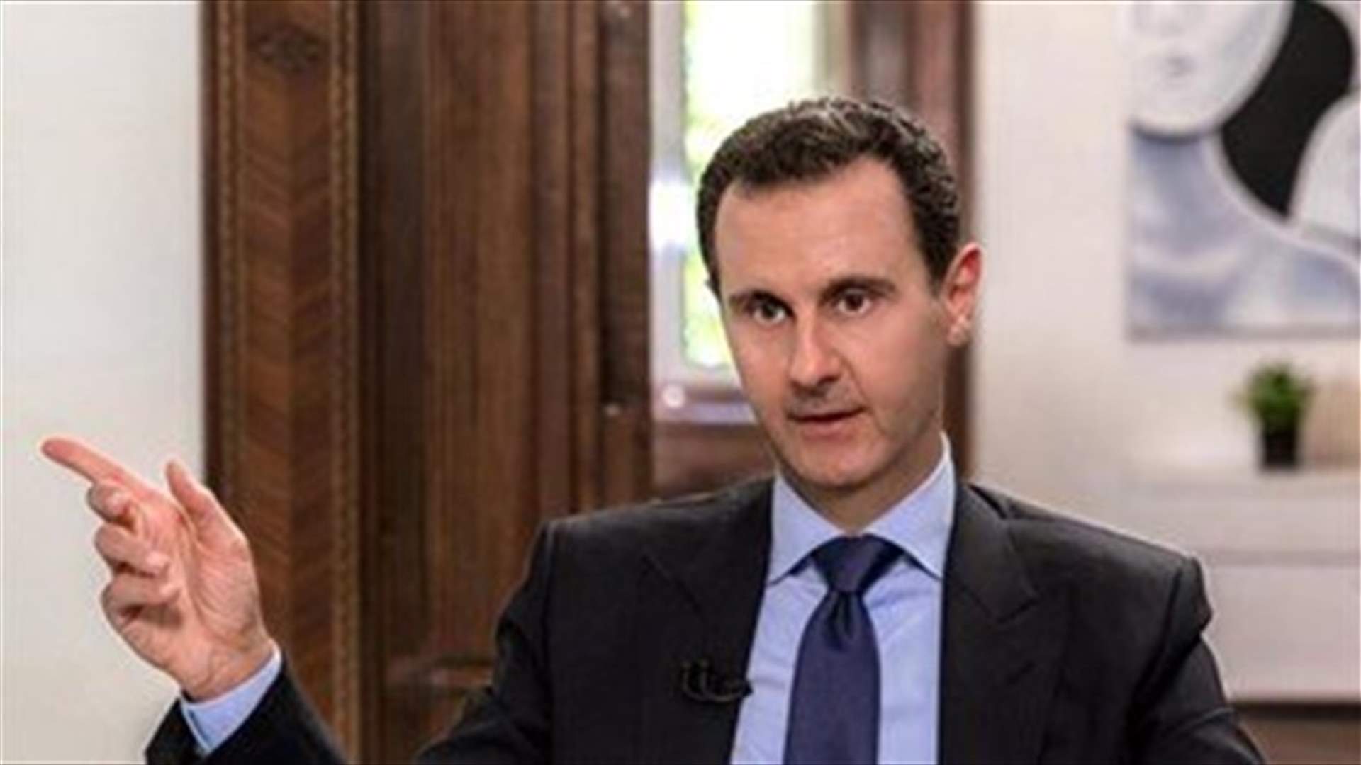 Syria Assad stops speech due to low blood pressure before resuming -state TV
