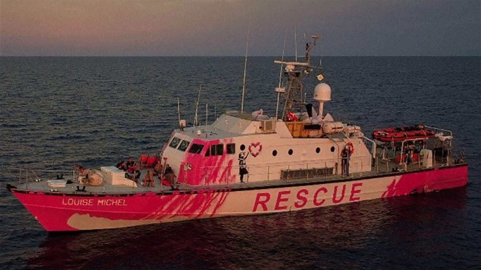 Banksy&#39;s migrant rescue boat says overloaded, stranded at sea