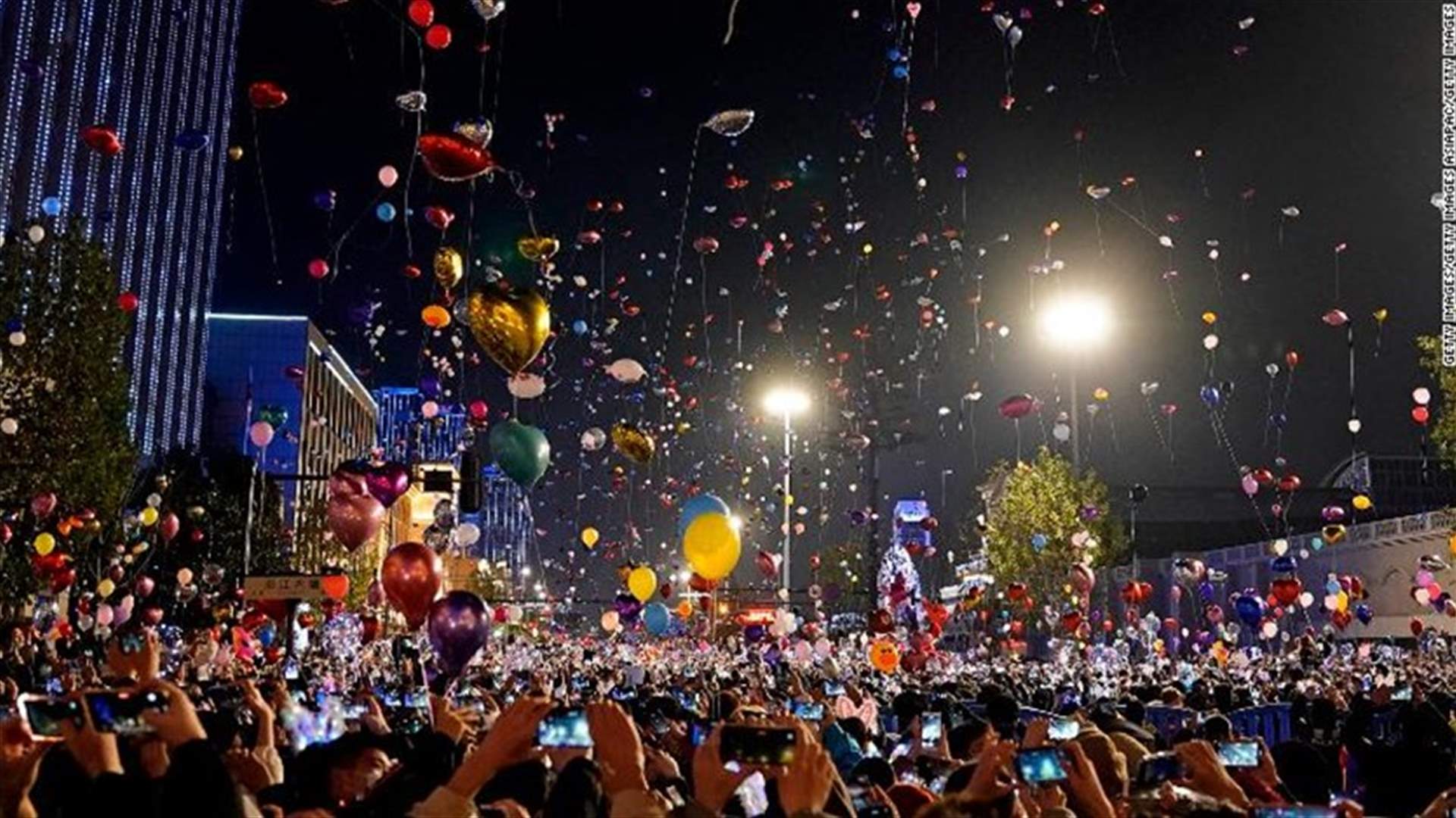 Crowds fill streets in China's pandemic-hit Wuhan, celebrate New Year
