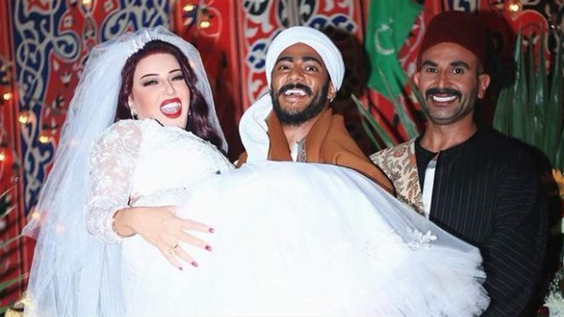 سمية الخشاب بالفستان الأبيض مع محمد رمضان... وطليقها أحمد سعد يغني لهما