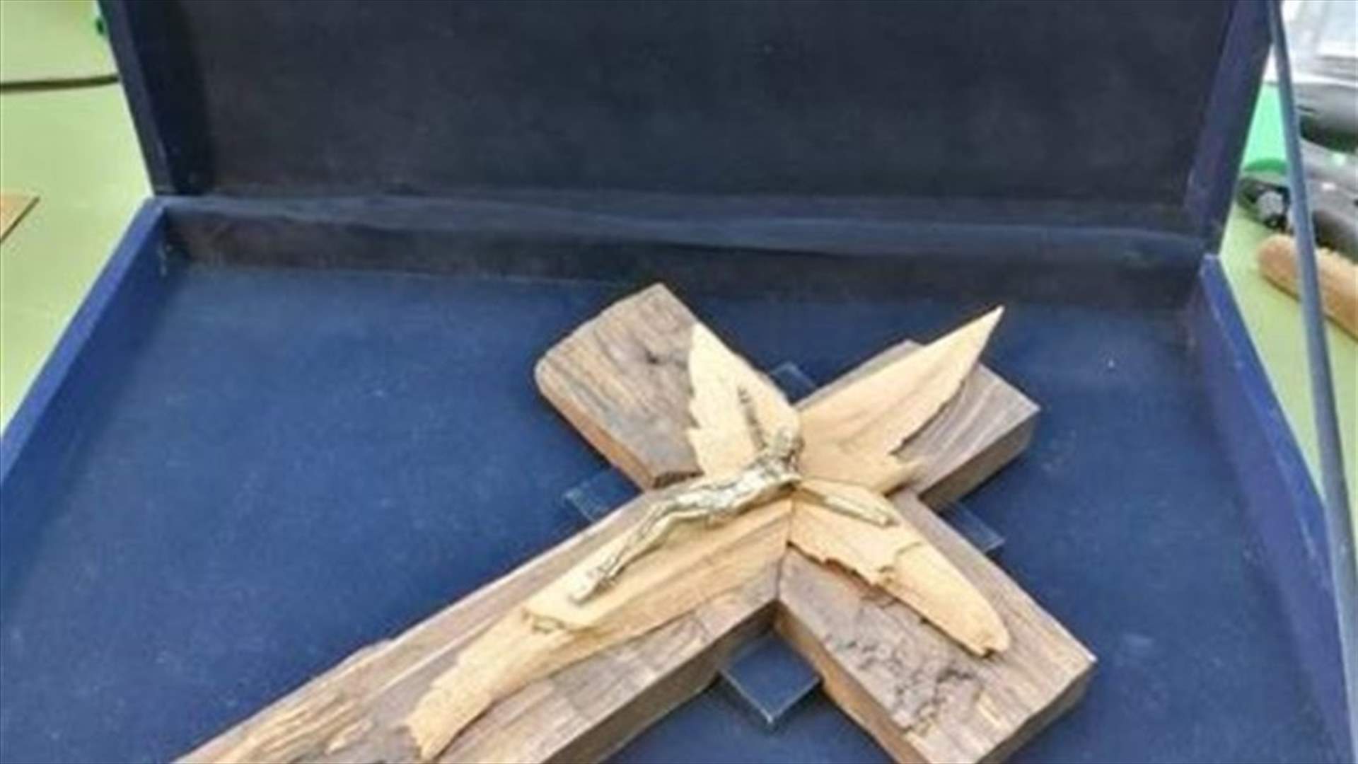 Cross made of Maronite Archdiocese of Beirut broken doors and windows handed to Pope Francis