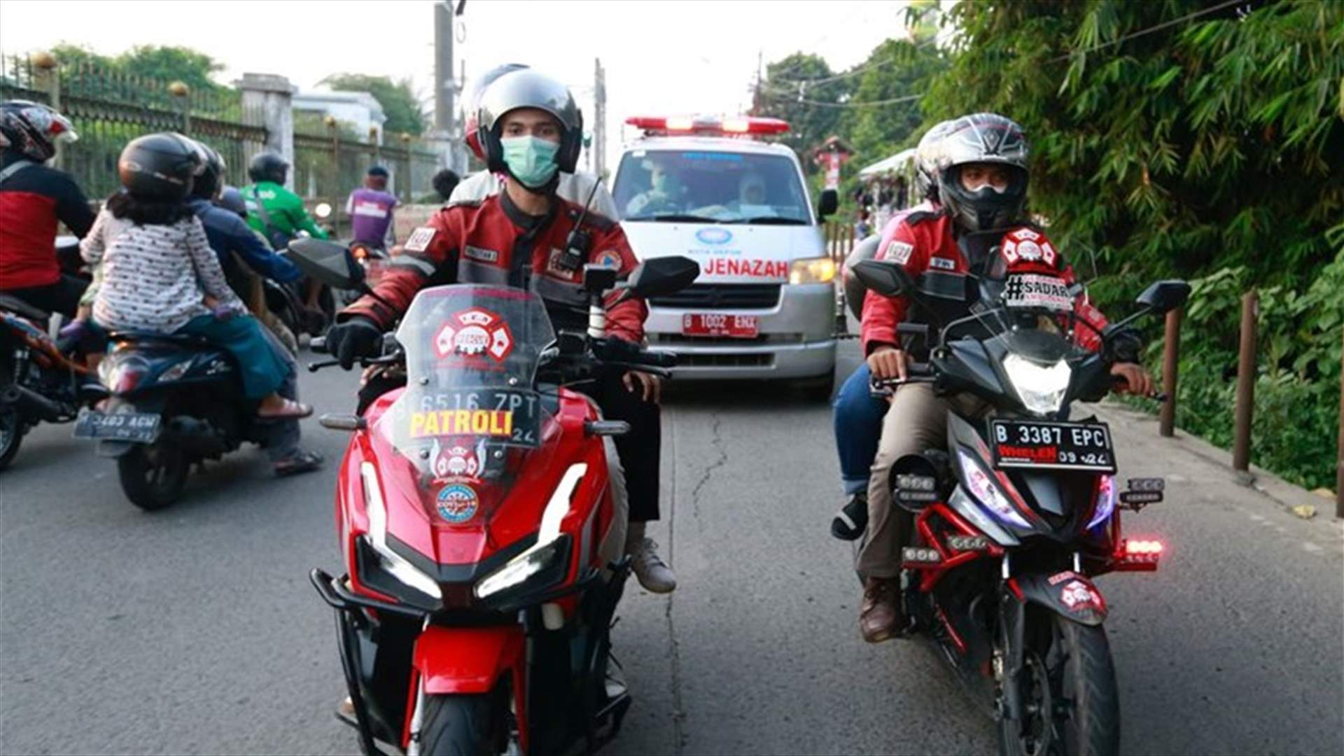 &#39;Call of duty&#39;: Indonesian bikers brave COVID-19 surge to escort ambulances