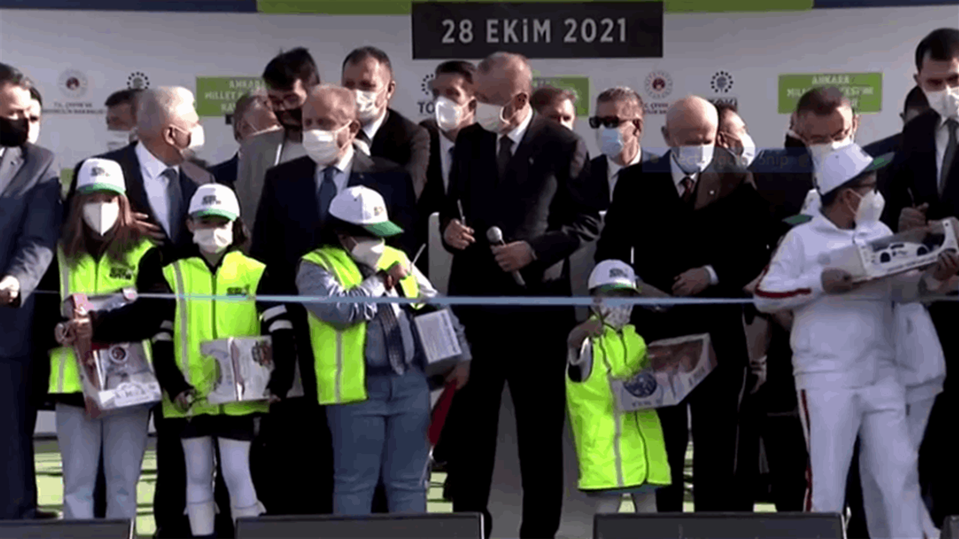 Girl competes with Turkey's Erdogan to cut ribbon at park opening