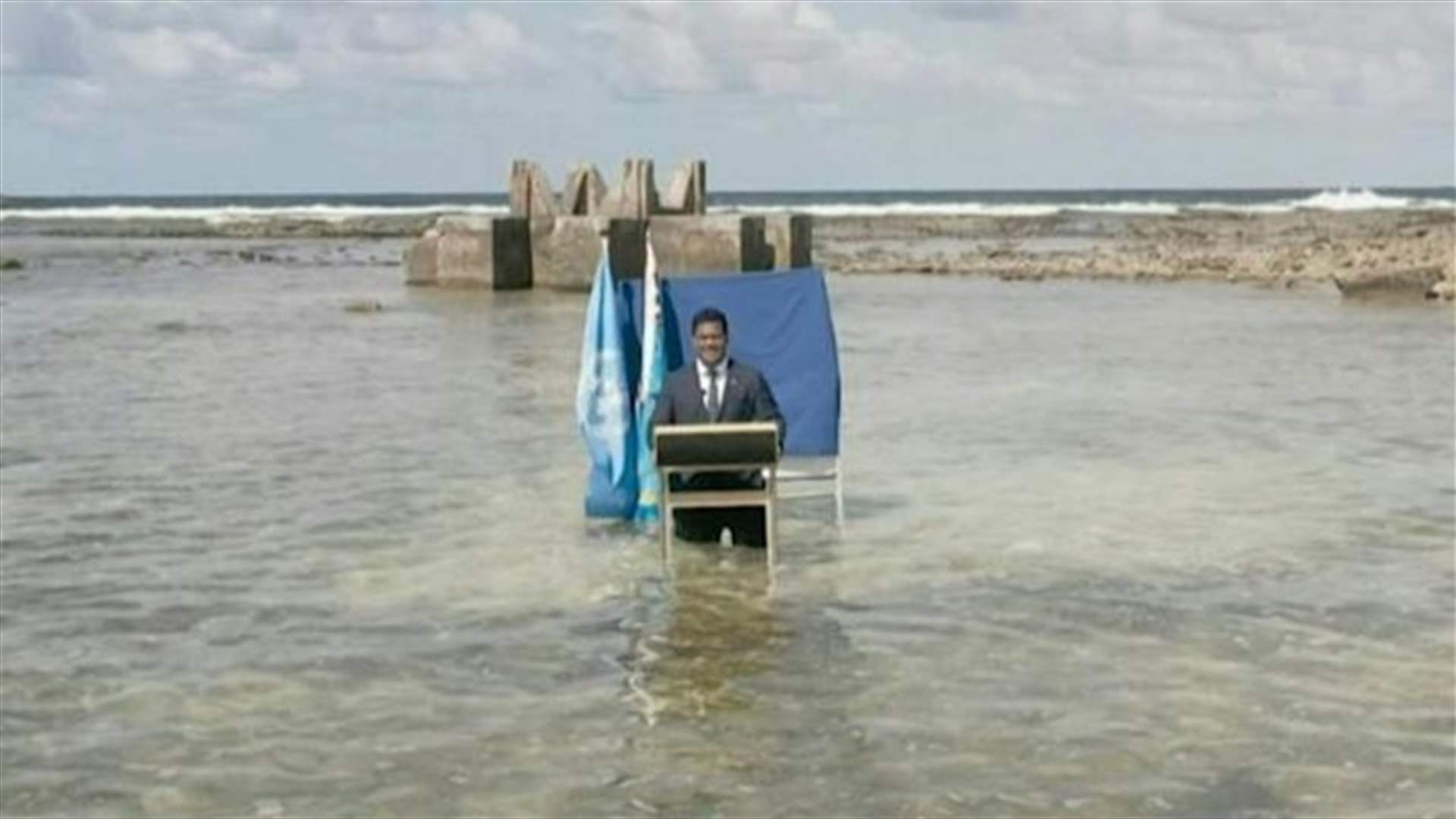 Tuvalu minister delivers COP26 speech knee-deep in the ocean