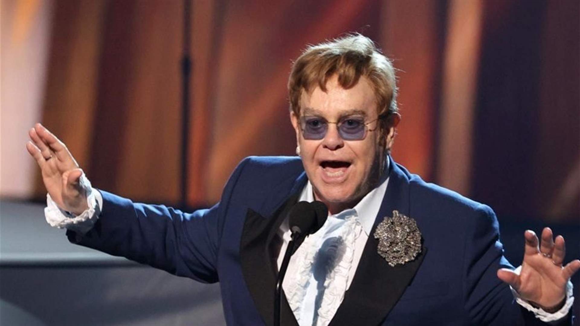 Elton John receives elite royal honor from Prince Charles