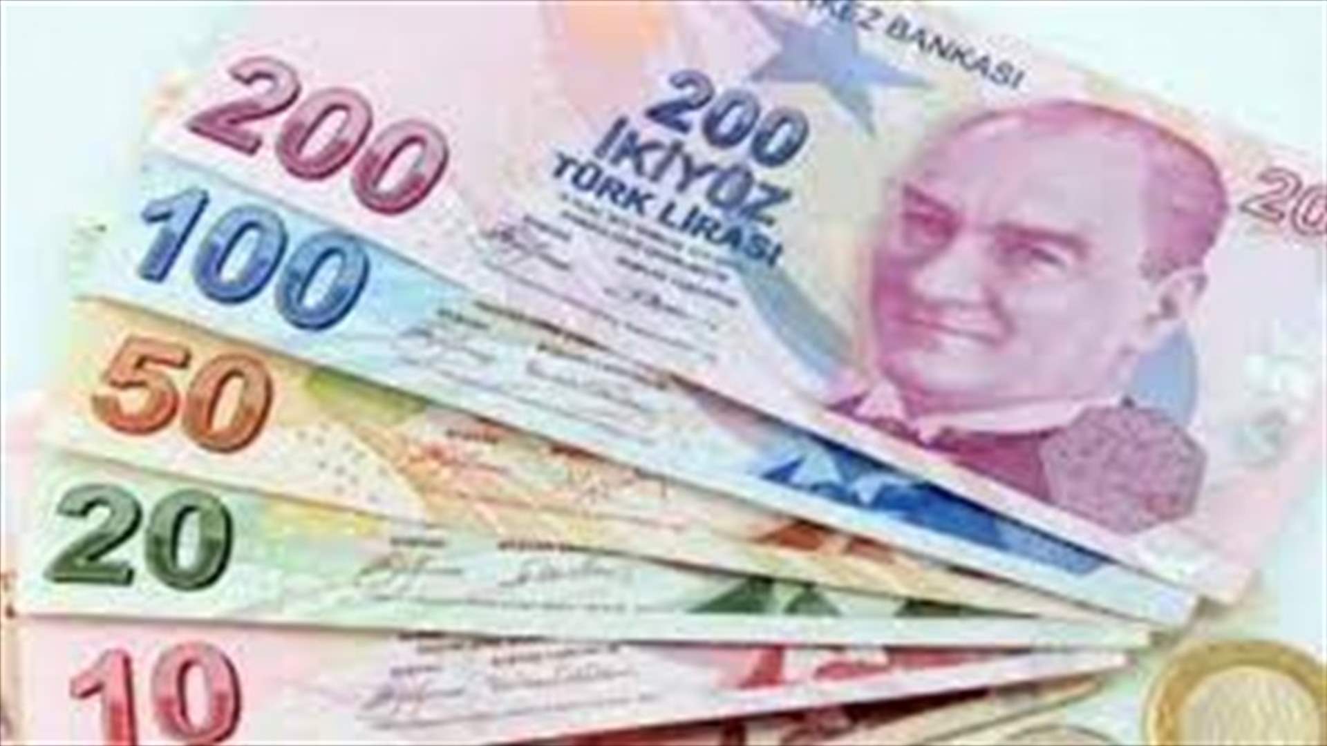 الليرة التركية تنزل إلى 12.9 مقابل الدولار
